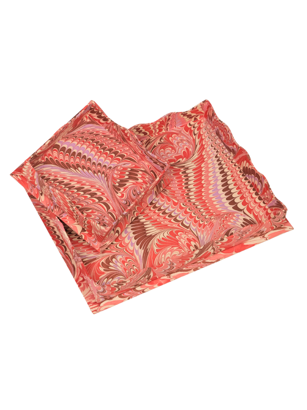Inner Child nesting scalloped hand-marbled trays in florentine pink