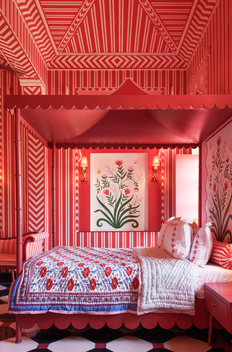 Red-striped bedroom with reversible cotton quilt and floral decor