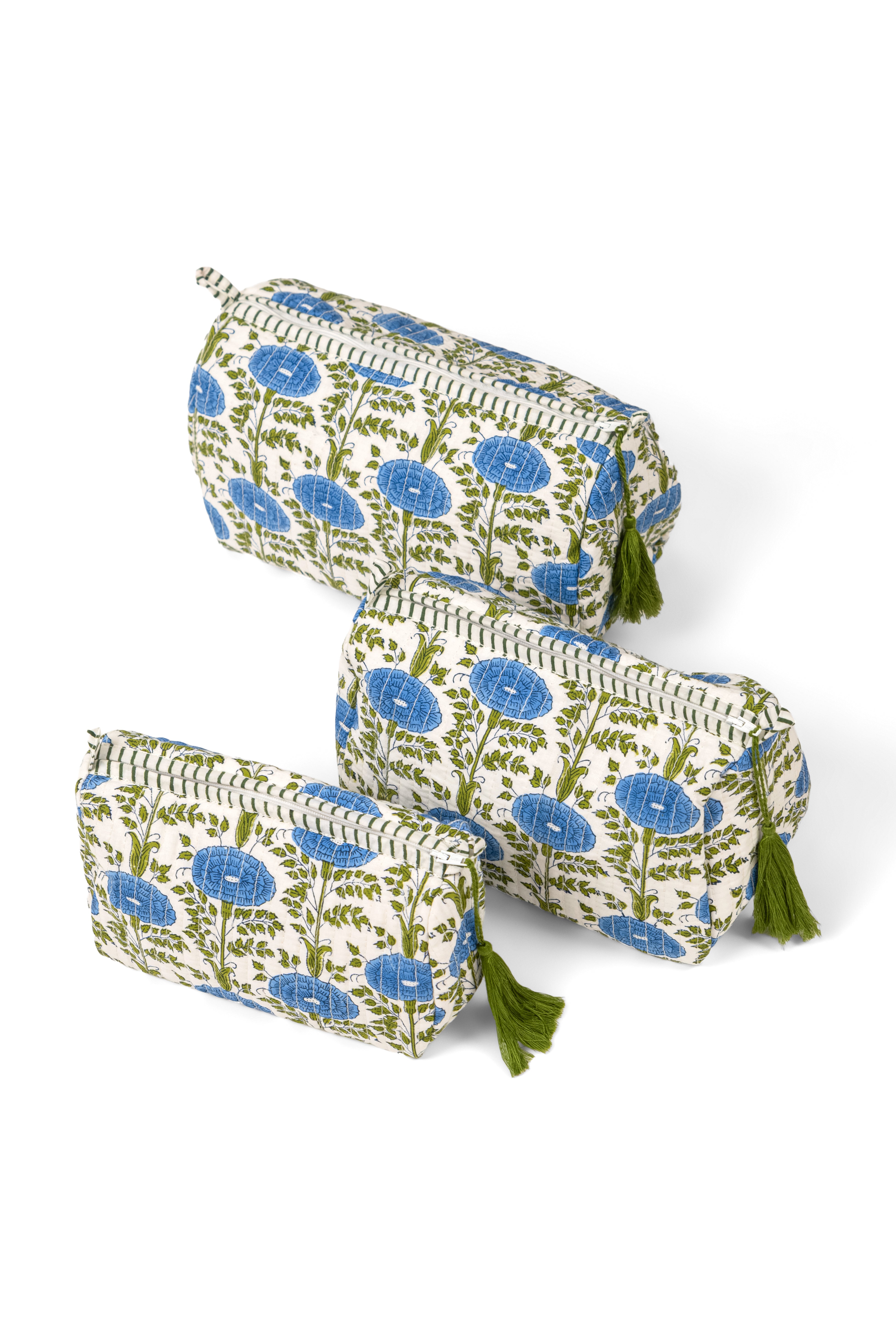 Three blue toiletry bags arranged together from Inner Child
