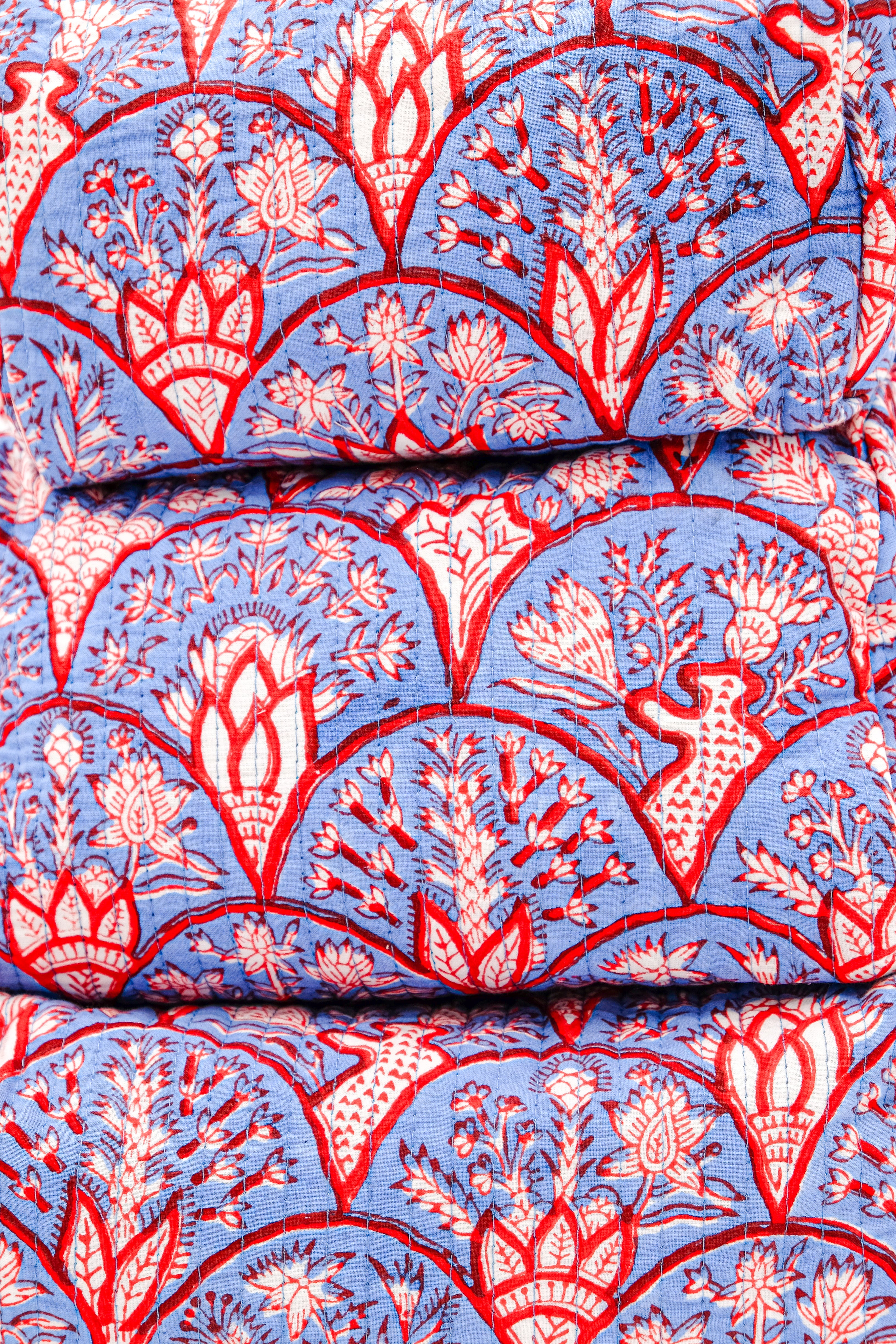 Blue Arch toiletry bag with red arch patterns from Inner Child studio