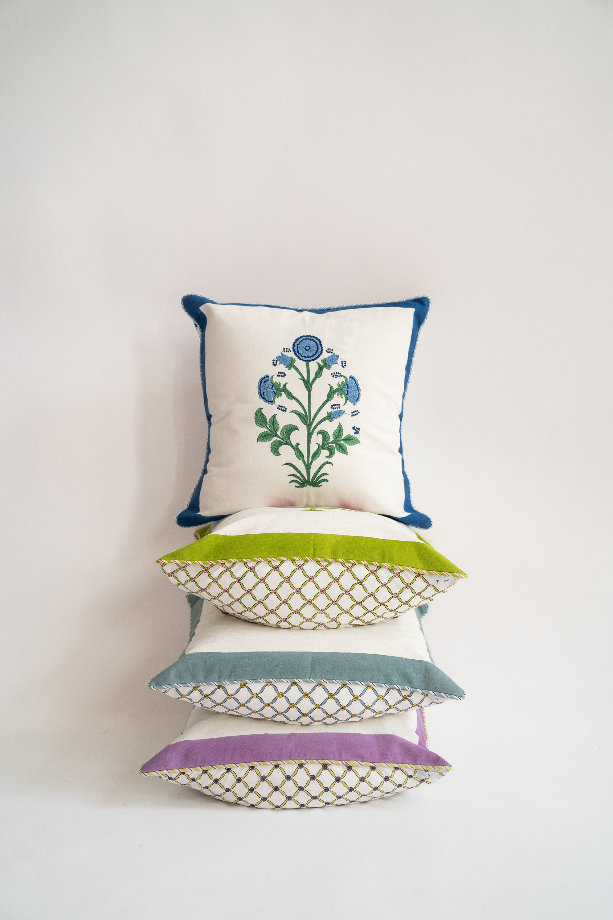 Stacked decorative pillows with cobalt blockprint top pillow