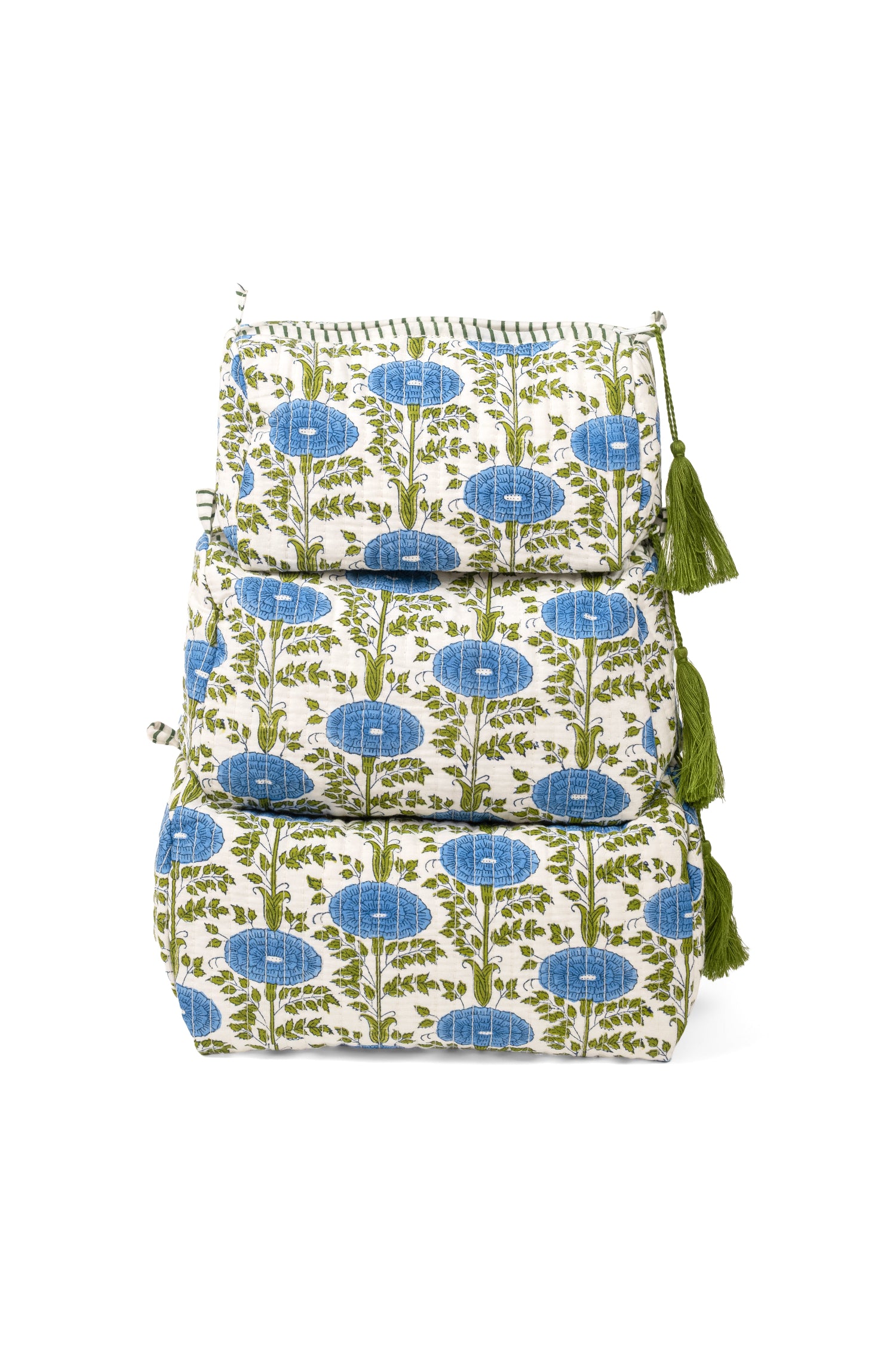 Stacked set of three blue toiletry bags from Inner Child