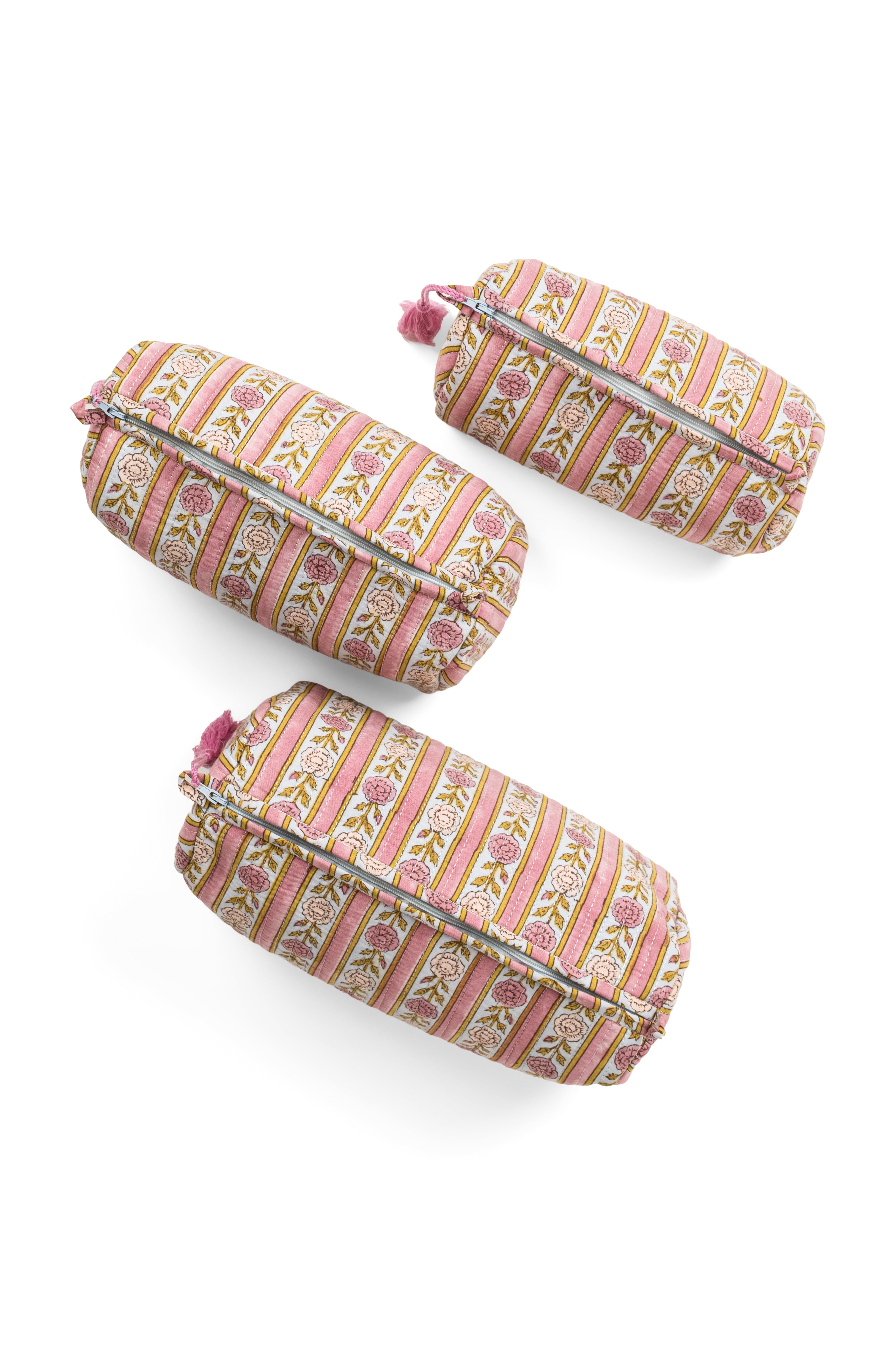Three vintage floral striped makeup bags with silver zippers and pink tassels