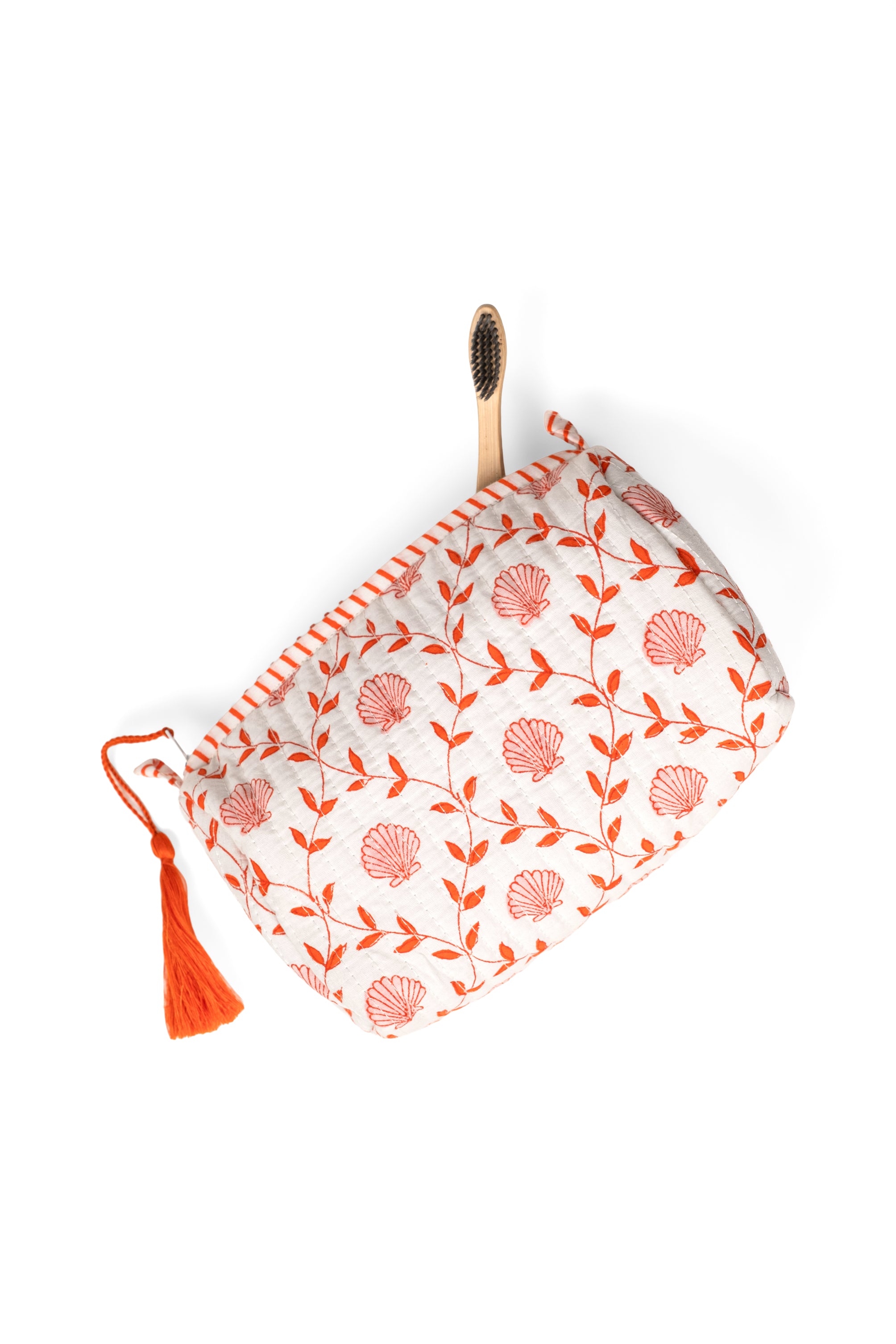 Single pink seashell blockprint makeup bag with wooden toothbrush