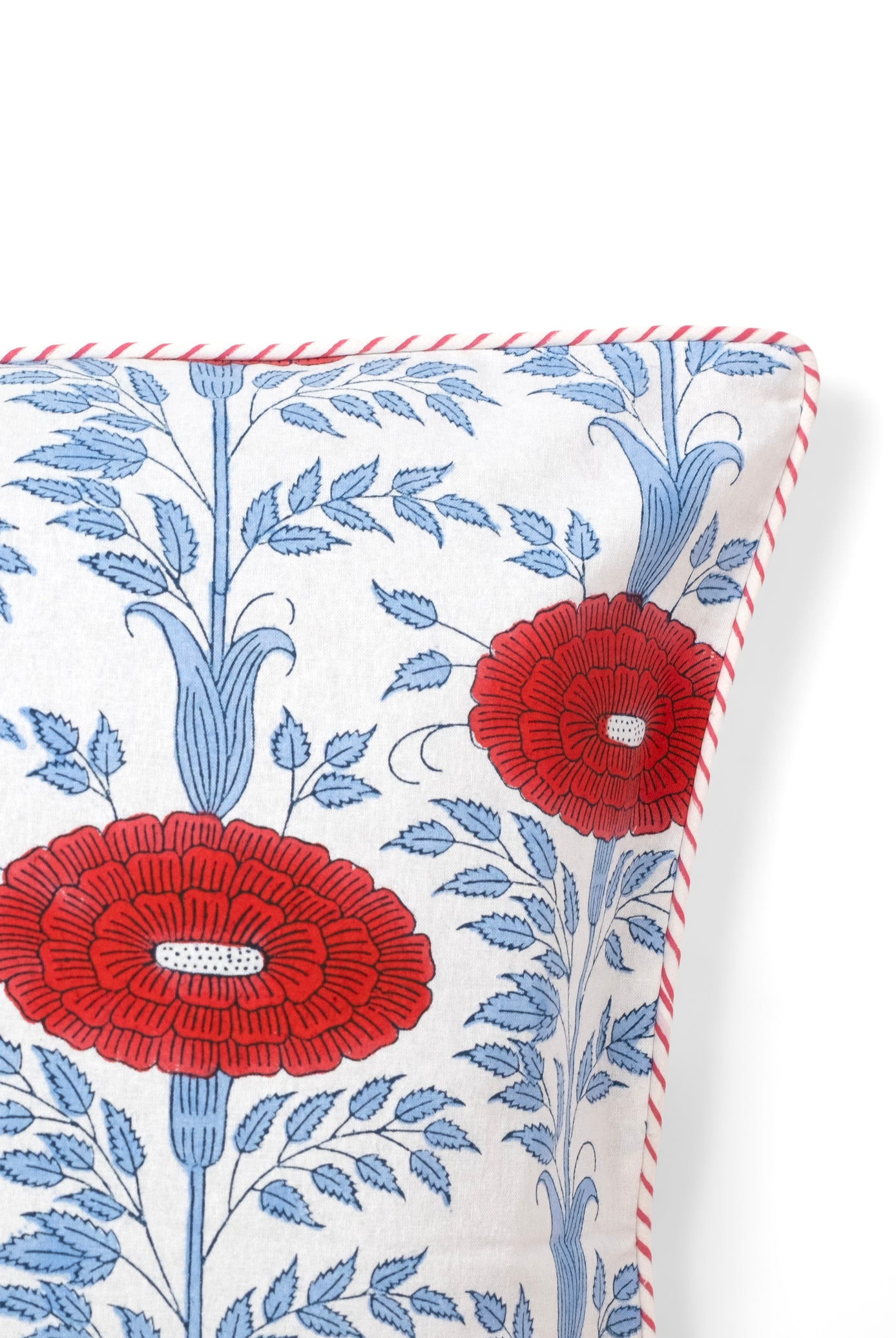 Close-up of red blockprint floral pillow detail from Inner Child