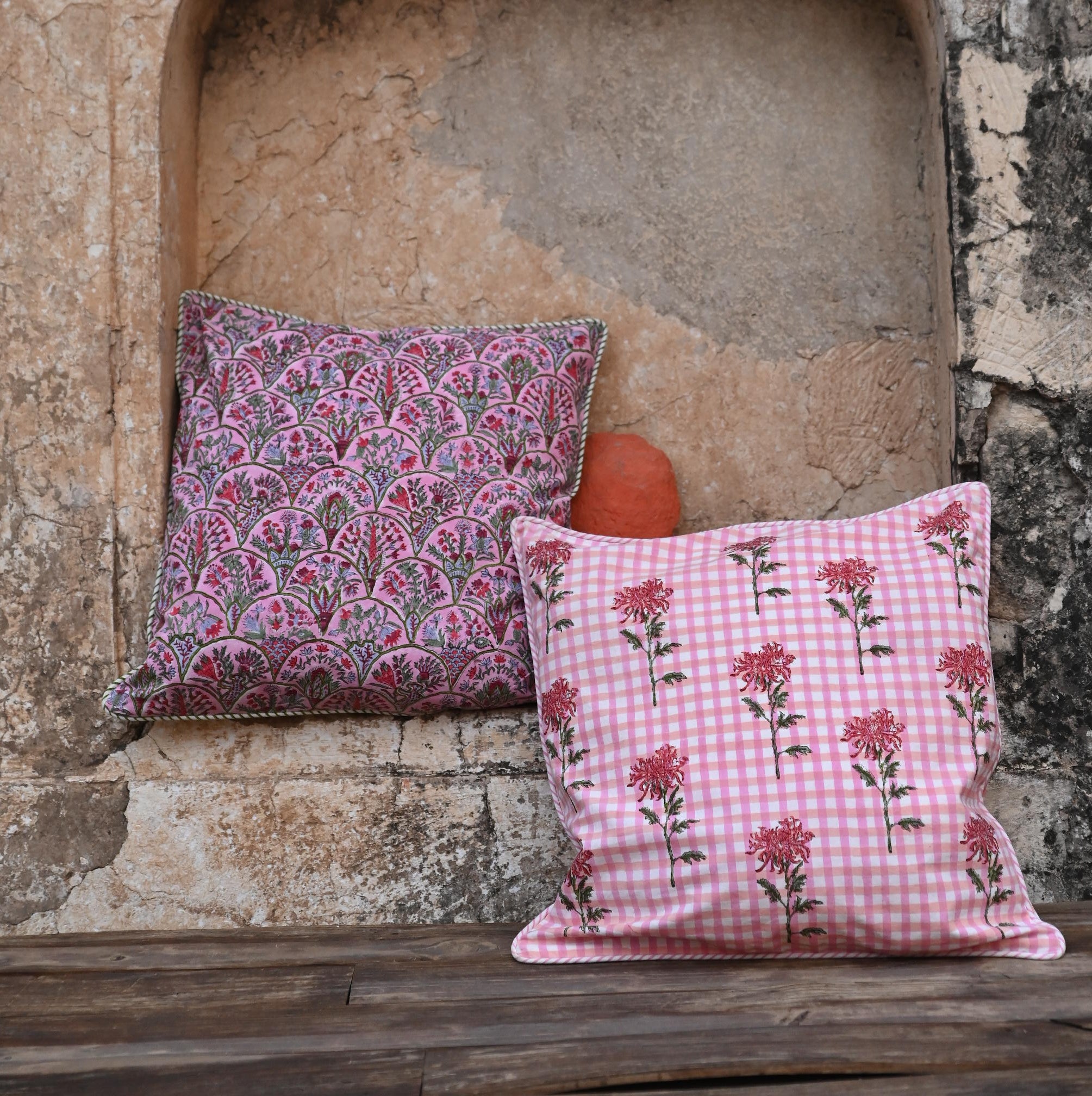 Pink arch blockprint reversible pillow with checkered floral in stone arch