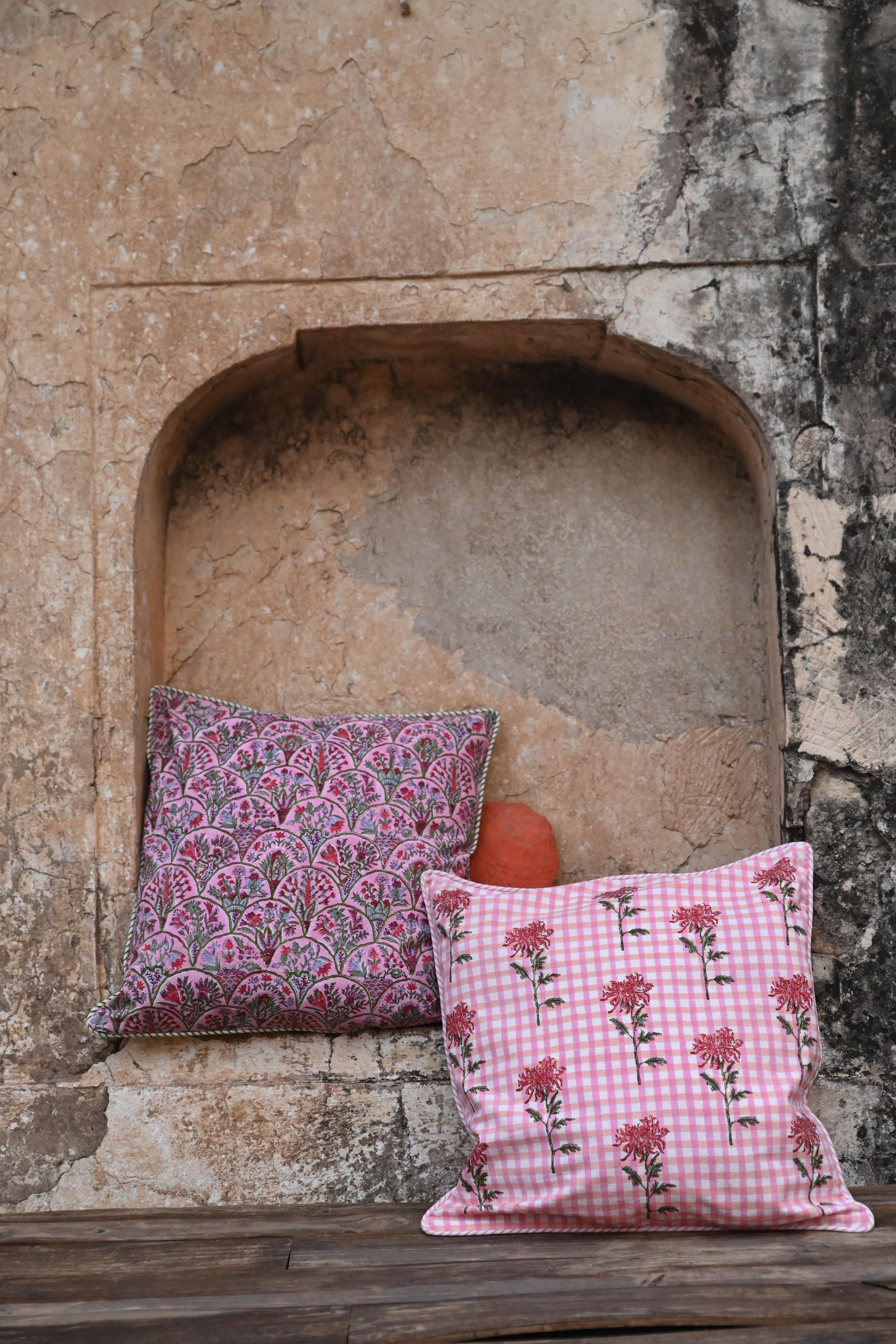 Pink arch blockprint reversible pillow with checkered floral in stone arch