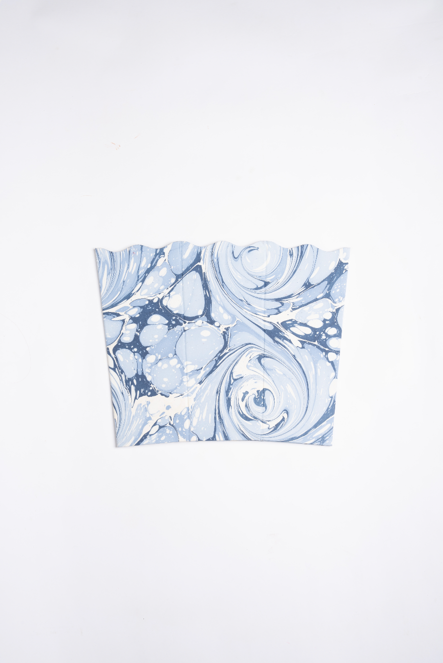 Hand-marbled scallop waste bin top view with blue/white swirl patterns - Inner Child