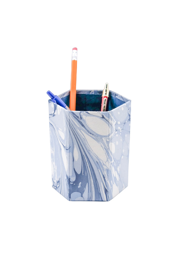 Hexagonal hand-marbled pencil holder from Inner Child in ocean wave design holding writing tools
