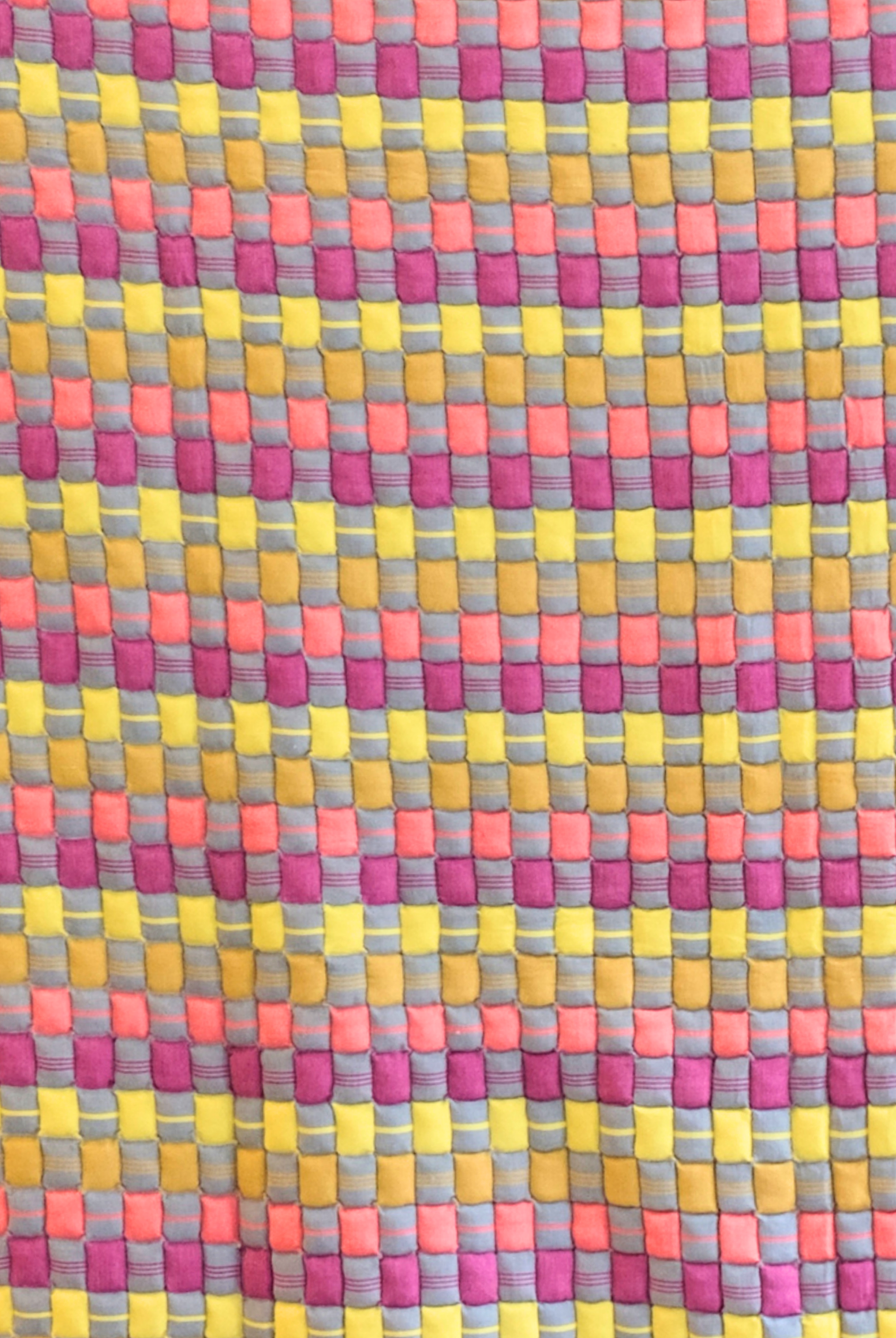 Close-up of colorful cotton candy sujani quilt pattern