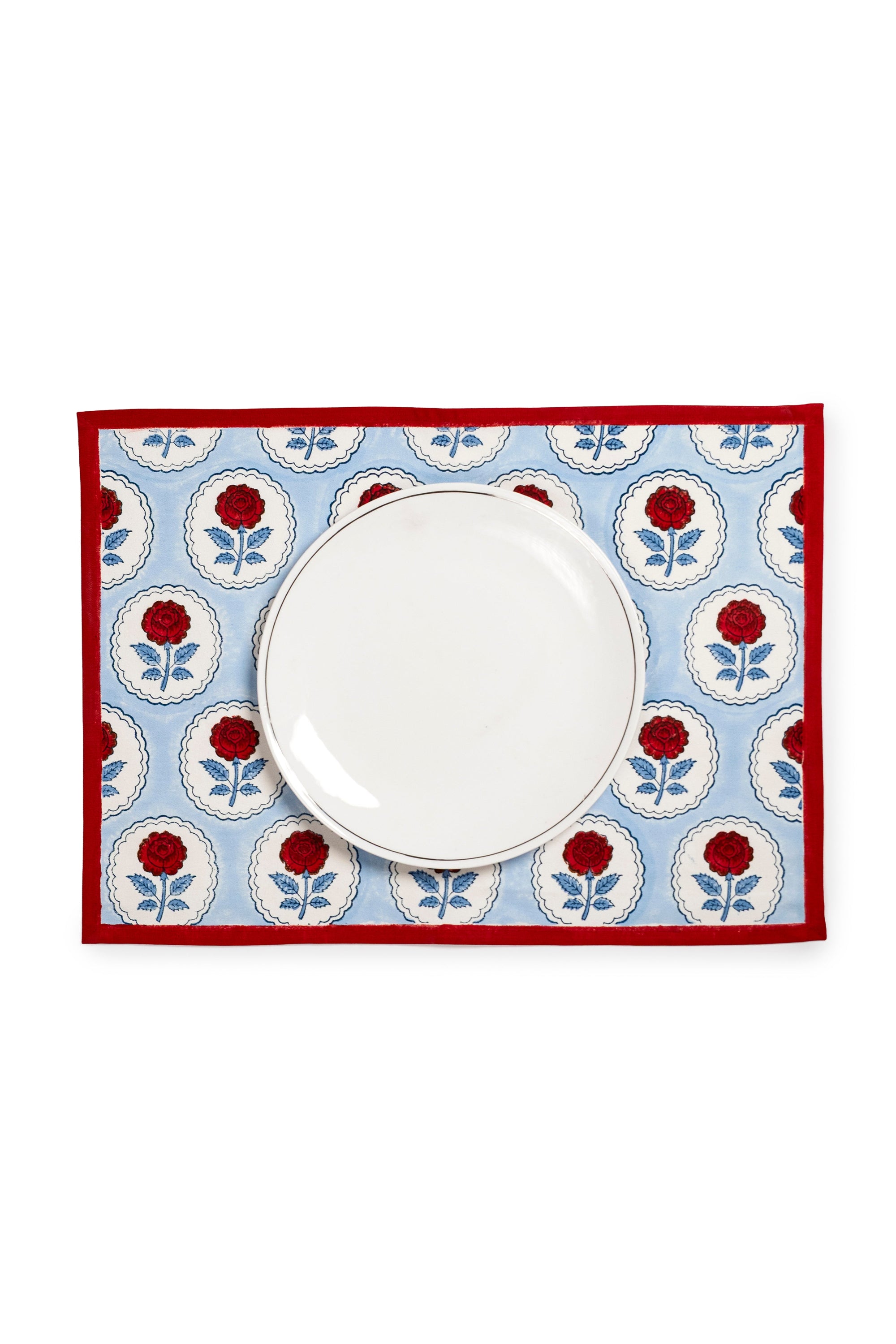 English Rose blockprint placemat blue/red pattern with white plate centered