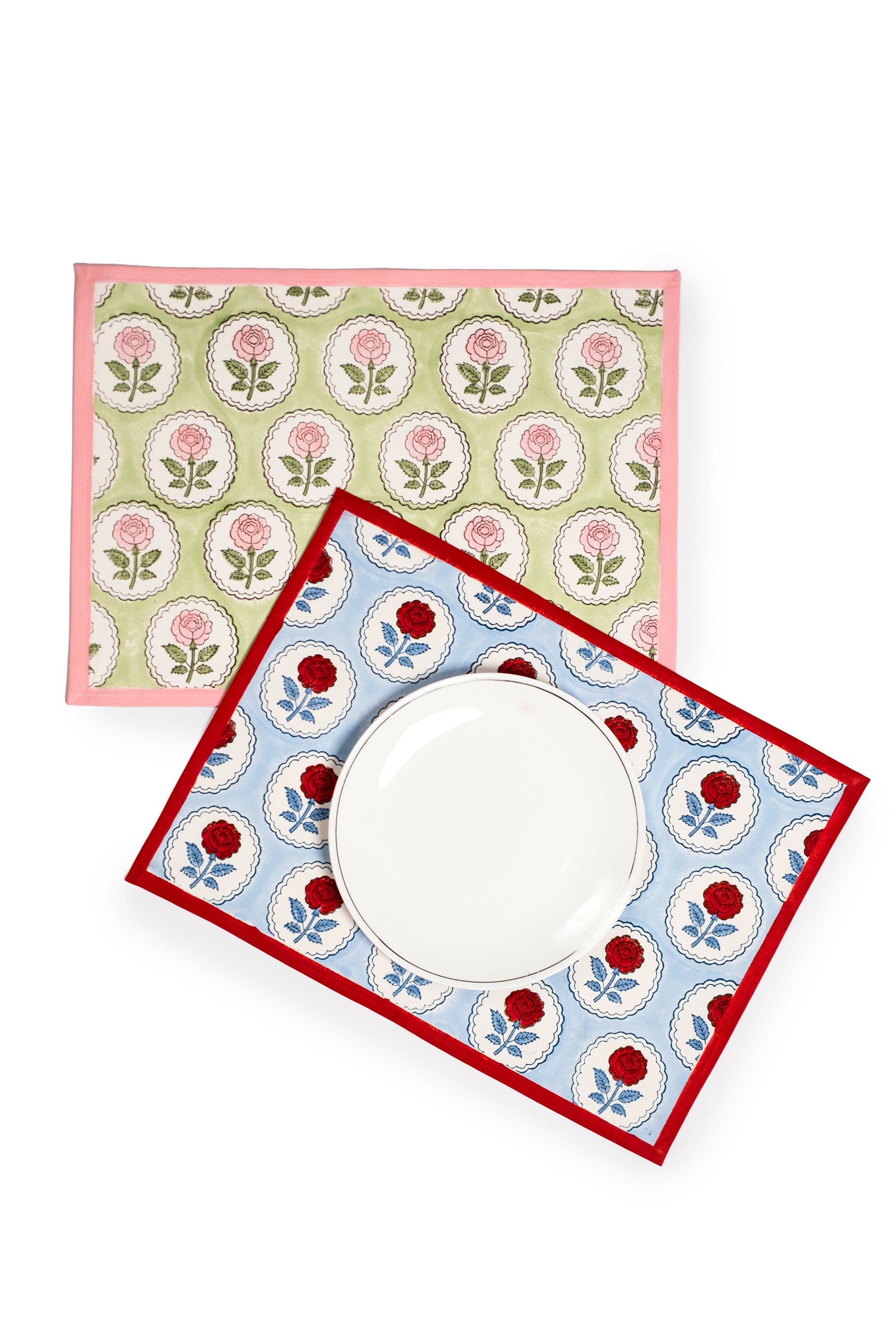 Two English Rose blockprint placemats, green/pink and blue/red designs with plate
