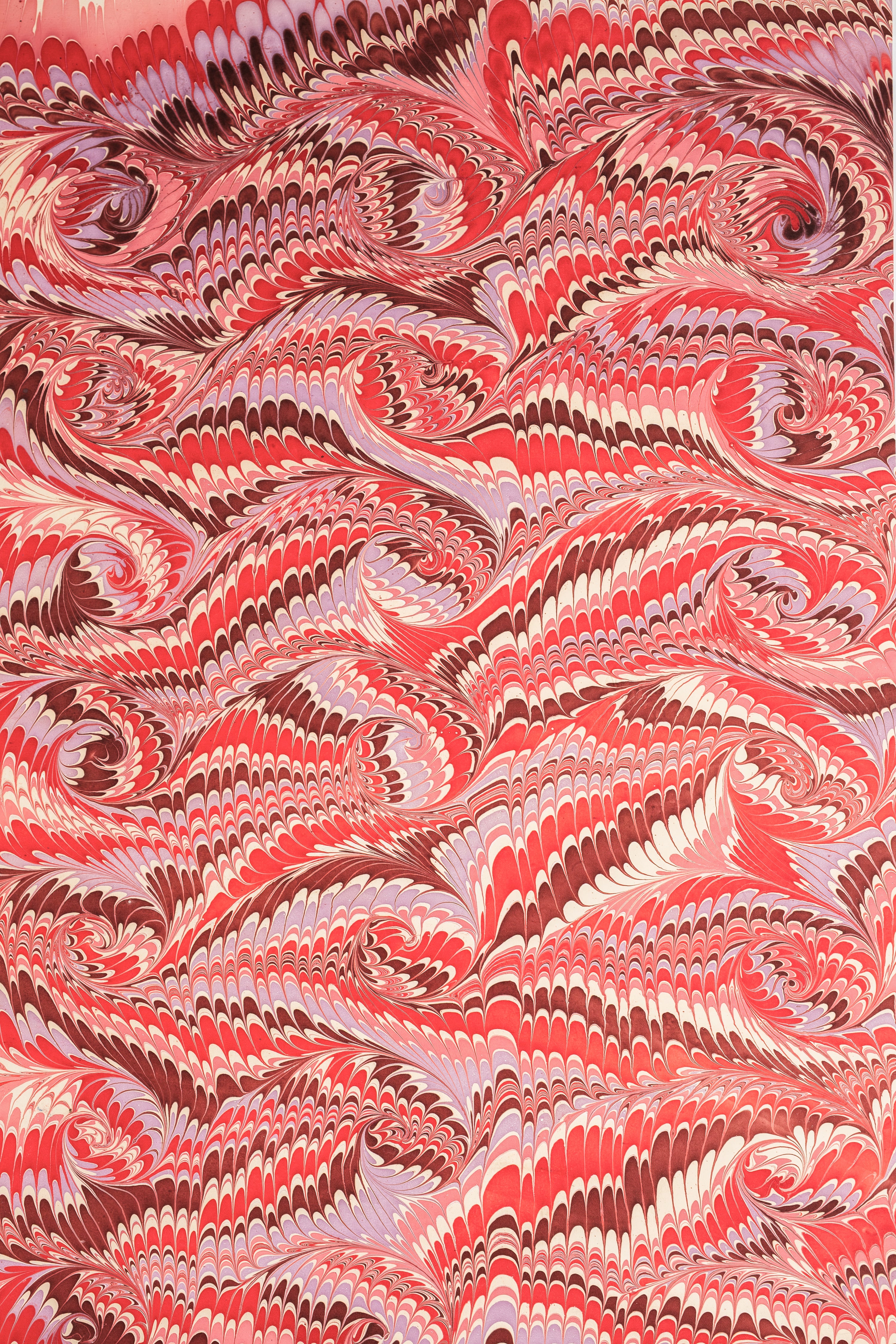 Full view of hand marbled florentine pink gift wrapping paper sheet
