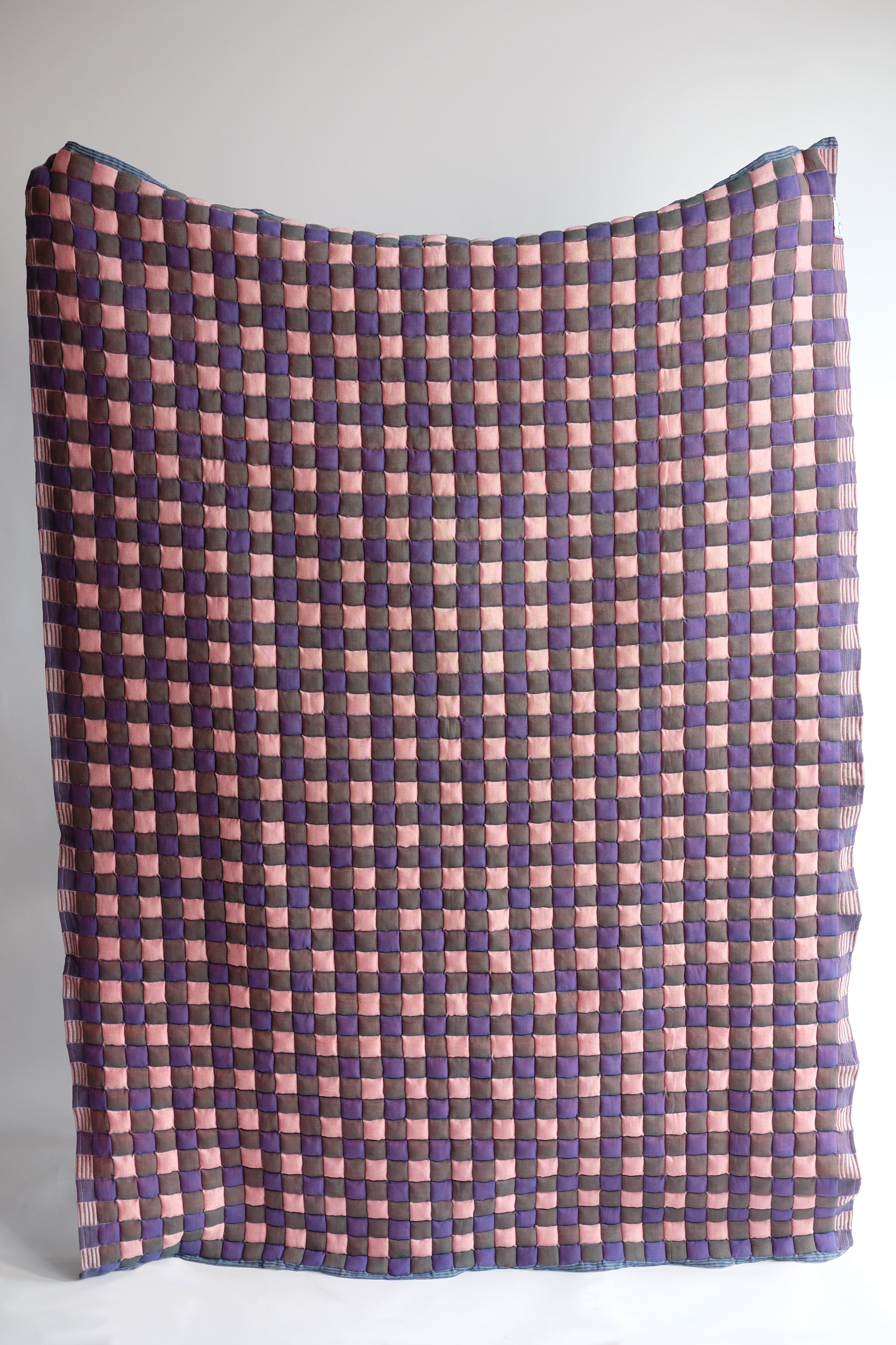 Pink brown purple checkered reversible Sujani quilt5. Close-up view of blue and green checkered Sujani quilt fabric