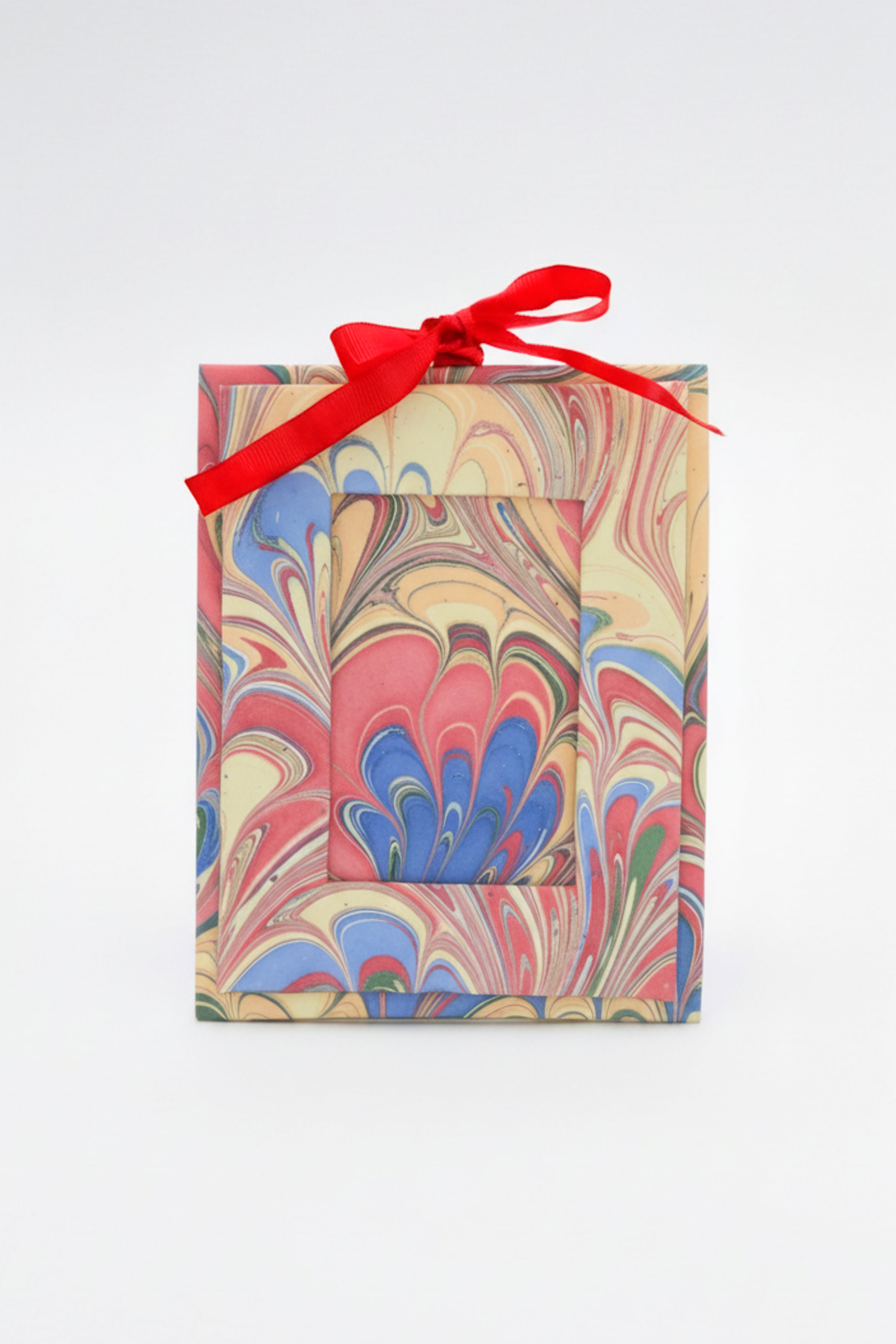 Mini hand-marbled picture frame ornament with pink-blue-orange patterns & red ribbon | Inner Child