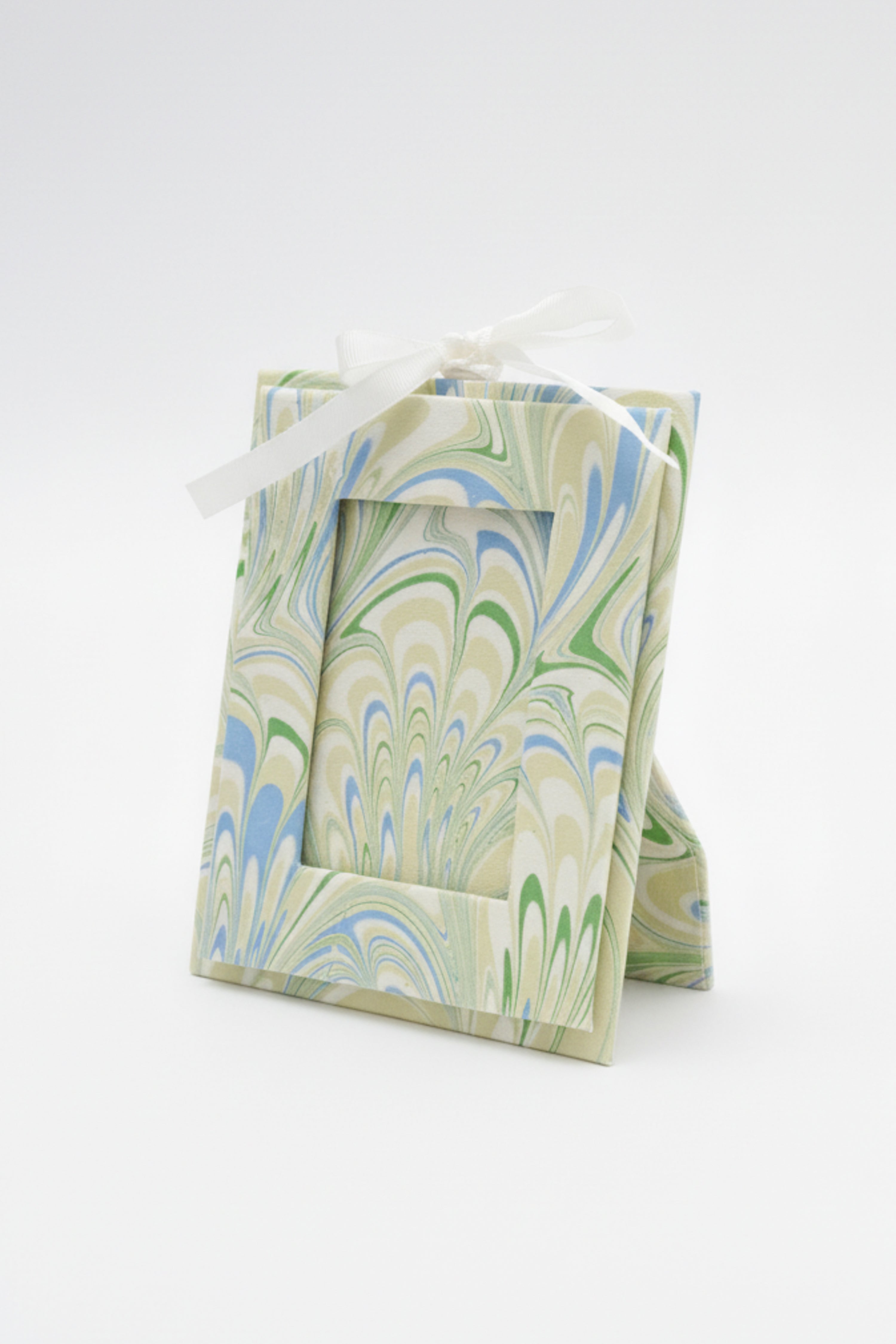 Hand-marbled picture frame ornament with seaglass peacock marbling and white ribbon