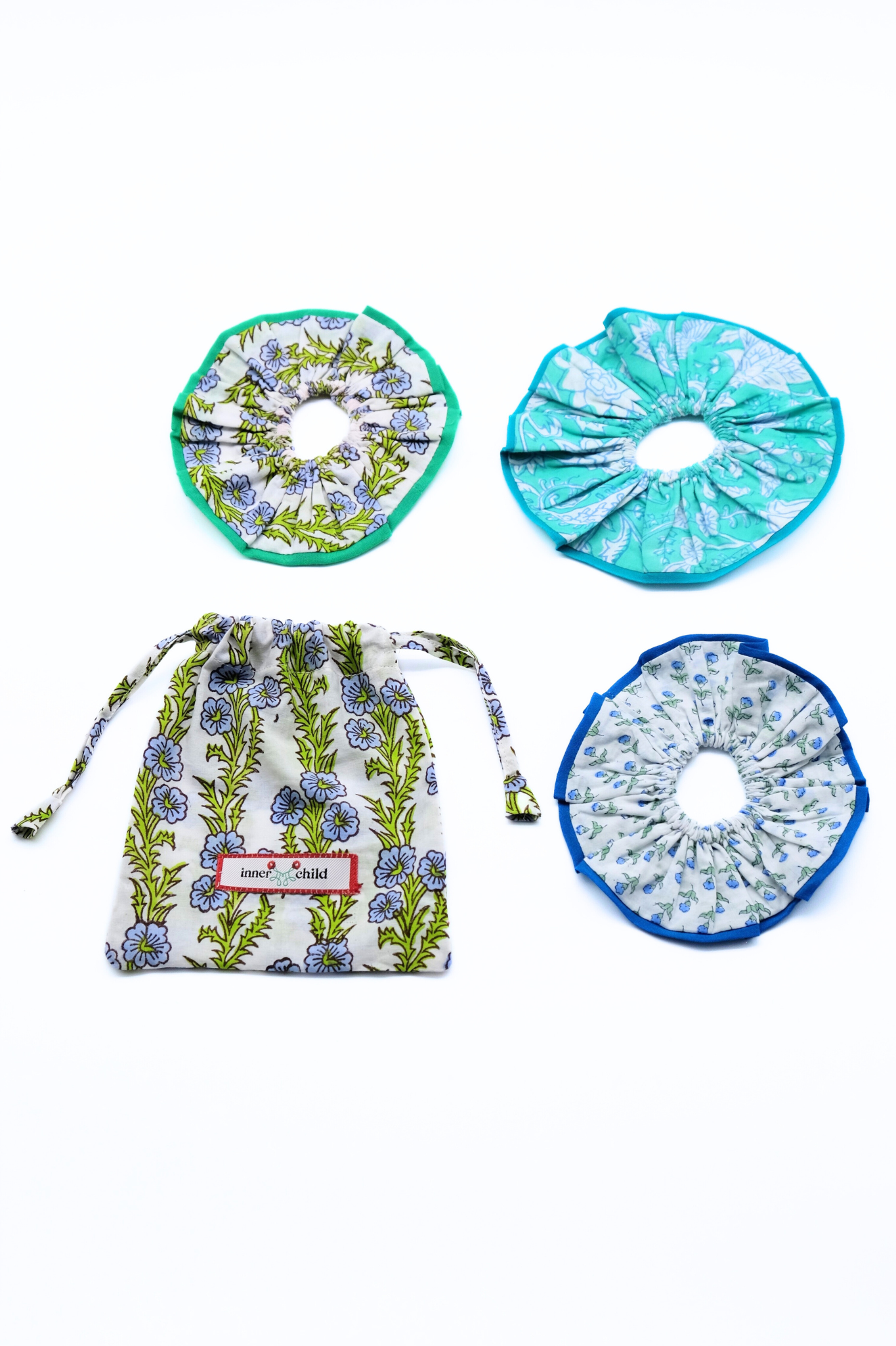 Maine block print scrunchie set with colorful floral patterns and matching Inner Child drawstring bag
