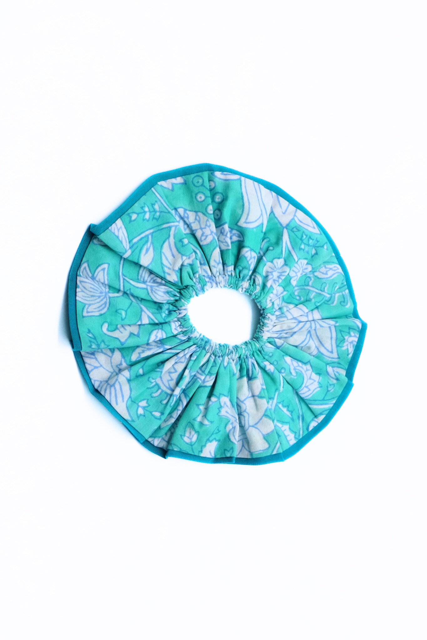 Teal-edged Maine block print scrunchie with botanical block print design