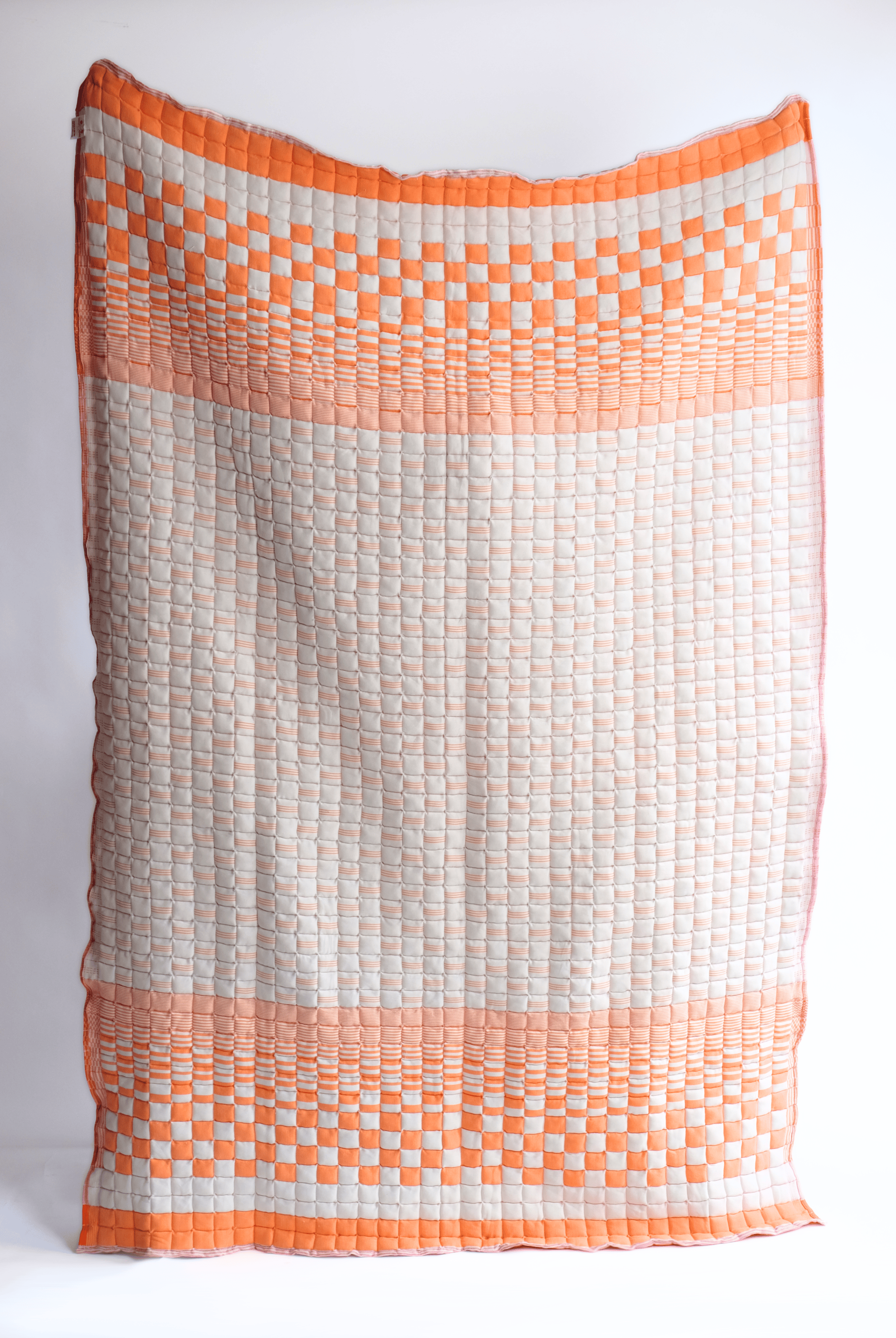 Bold orange reversible sujani quilt with square pattern - Inner Child