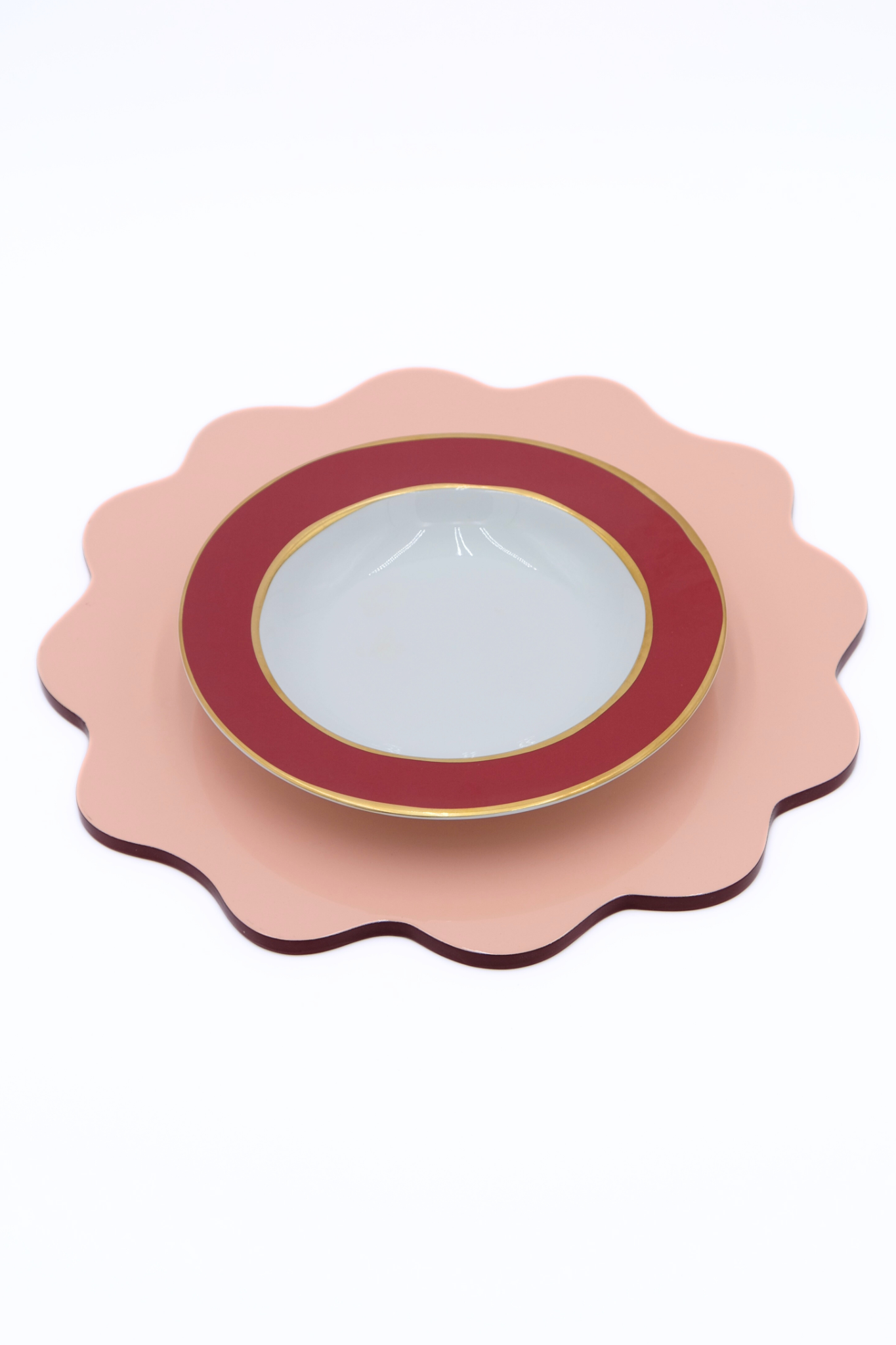Blush pink scalloped placemat with decorative plate