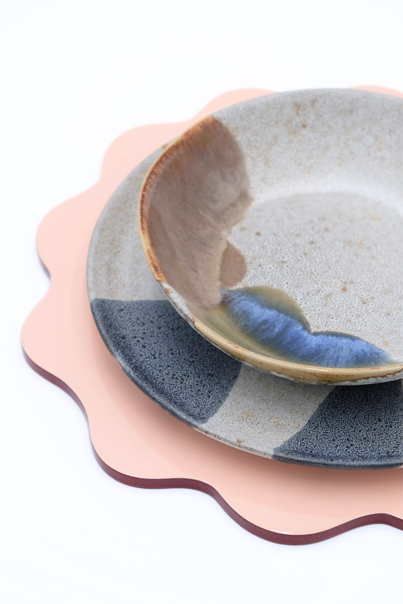 Blush pink scalloped placemat with ceramic dishware set