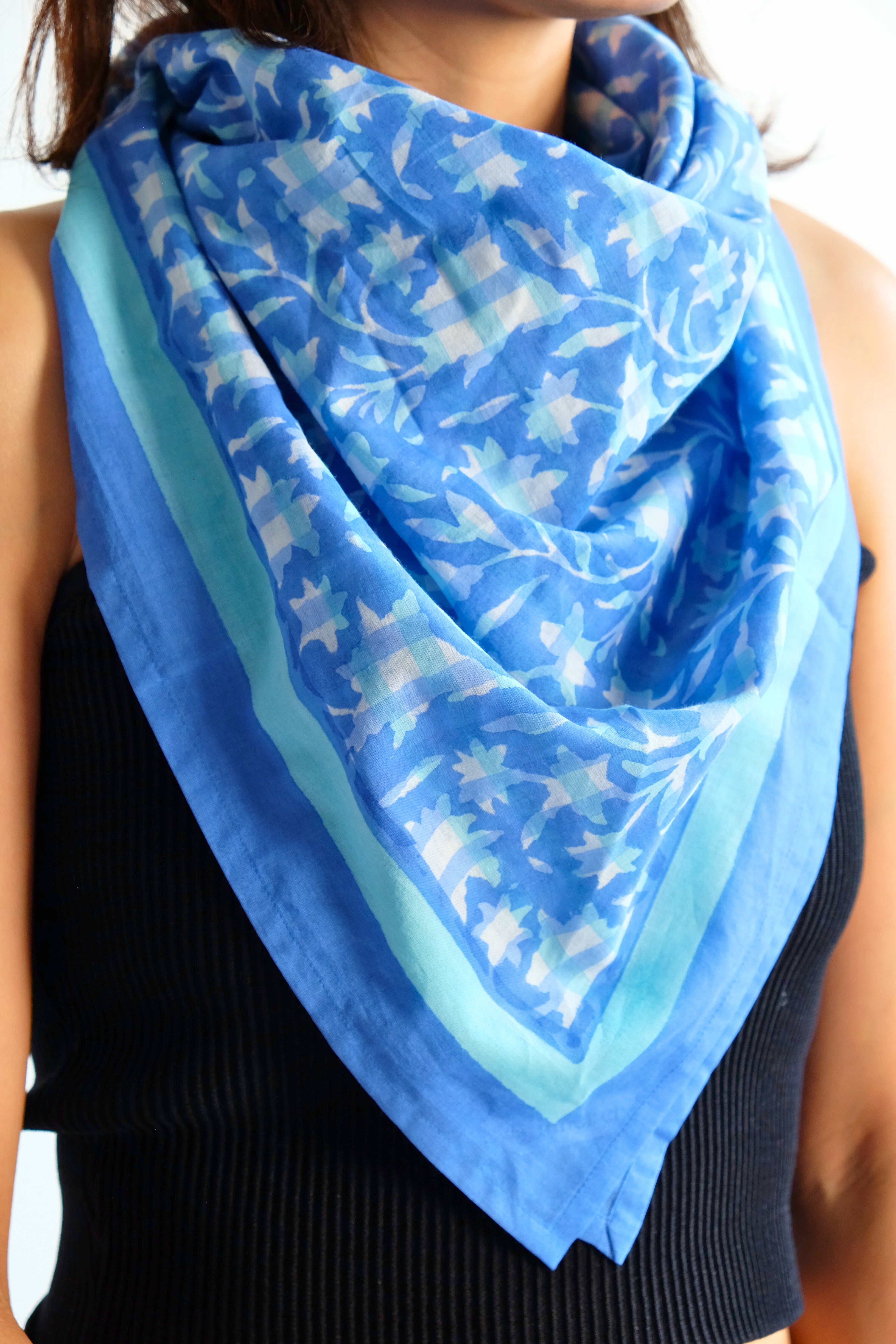 Woman wearing blue organic cotton blockprint scarf styled around neck, Inner Child