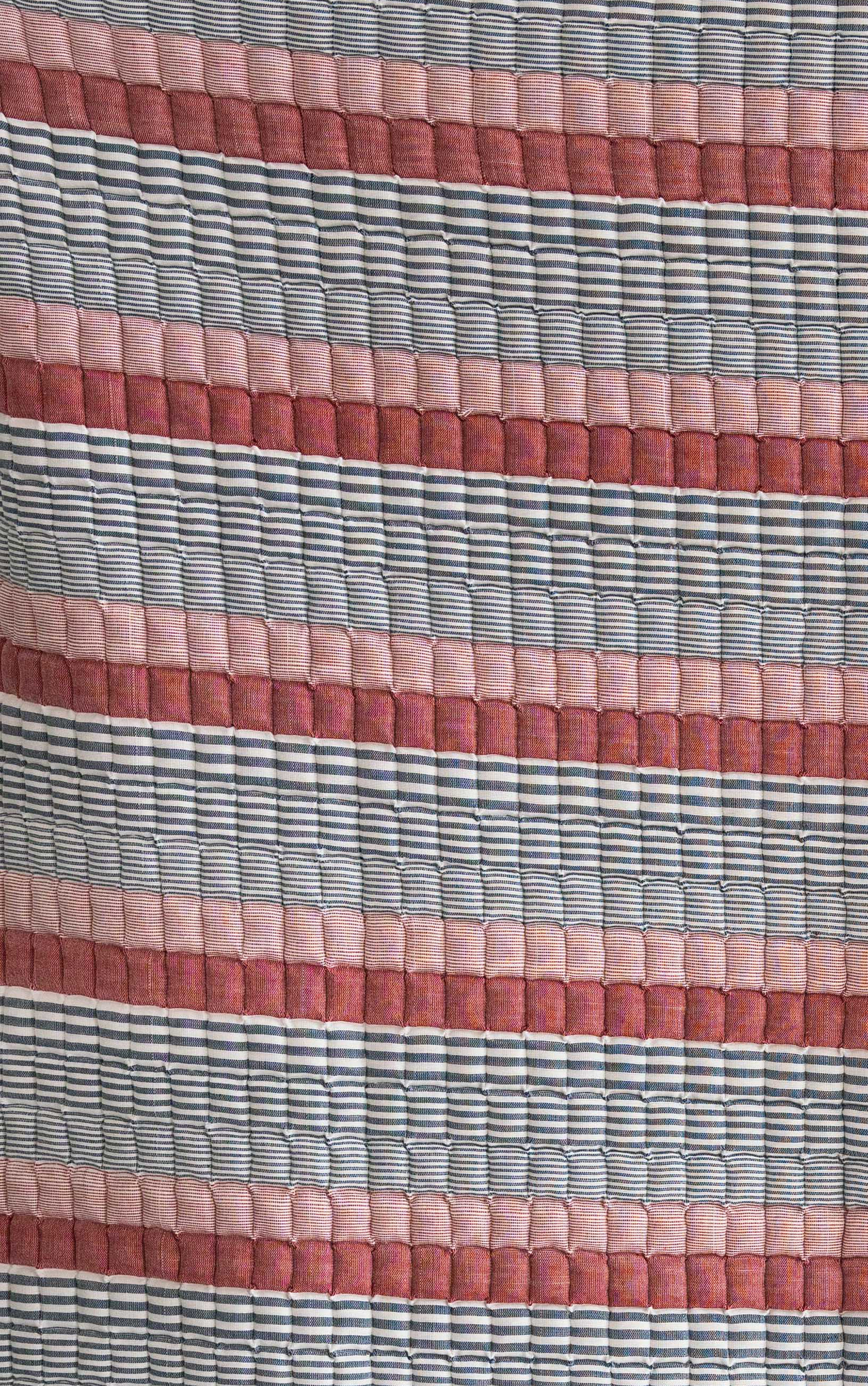 Red, white, blue striped Americana Sujani quilt with traditional quilted pattern