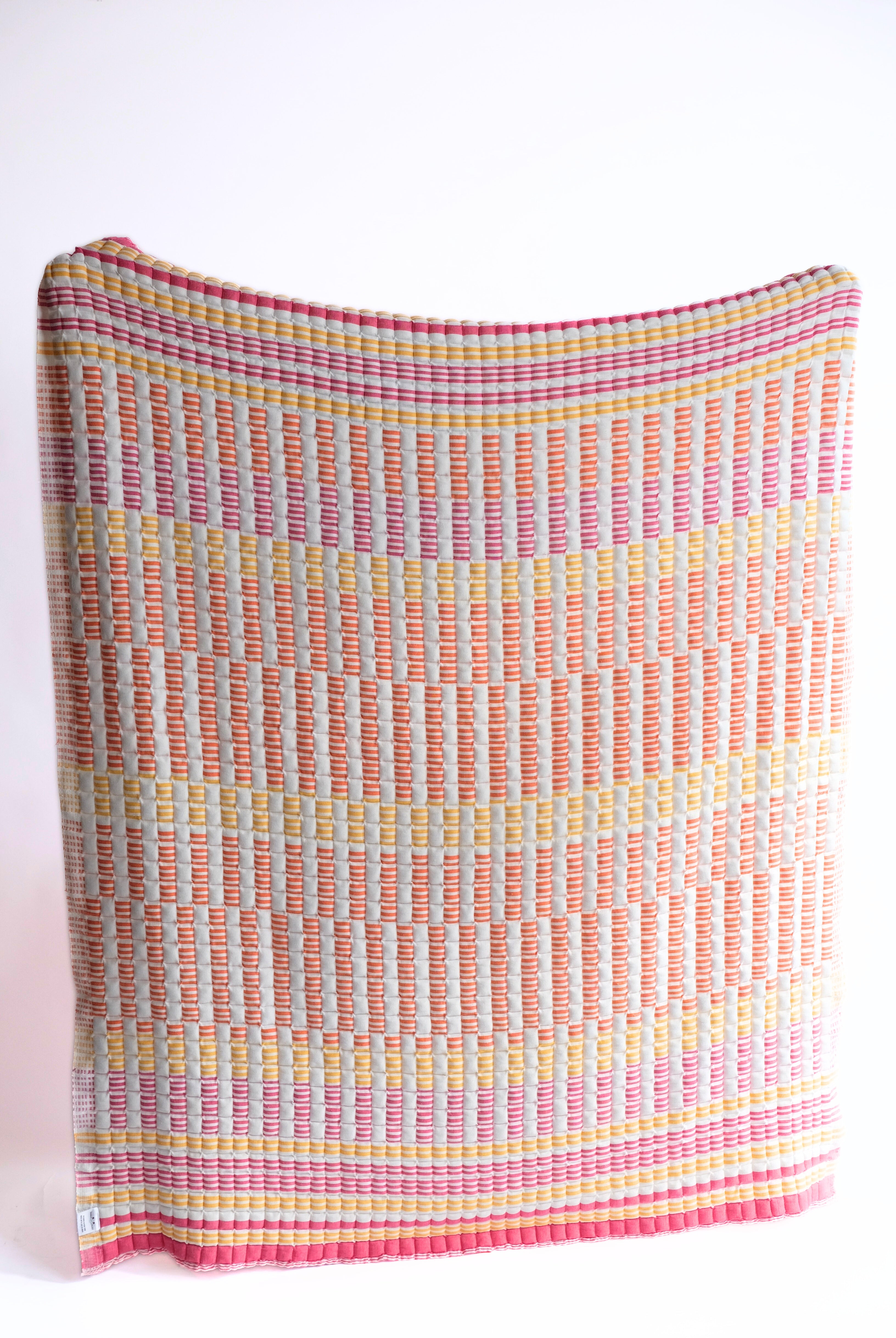 Colorful striped sunset sujani quilt from Inner Child