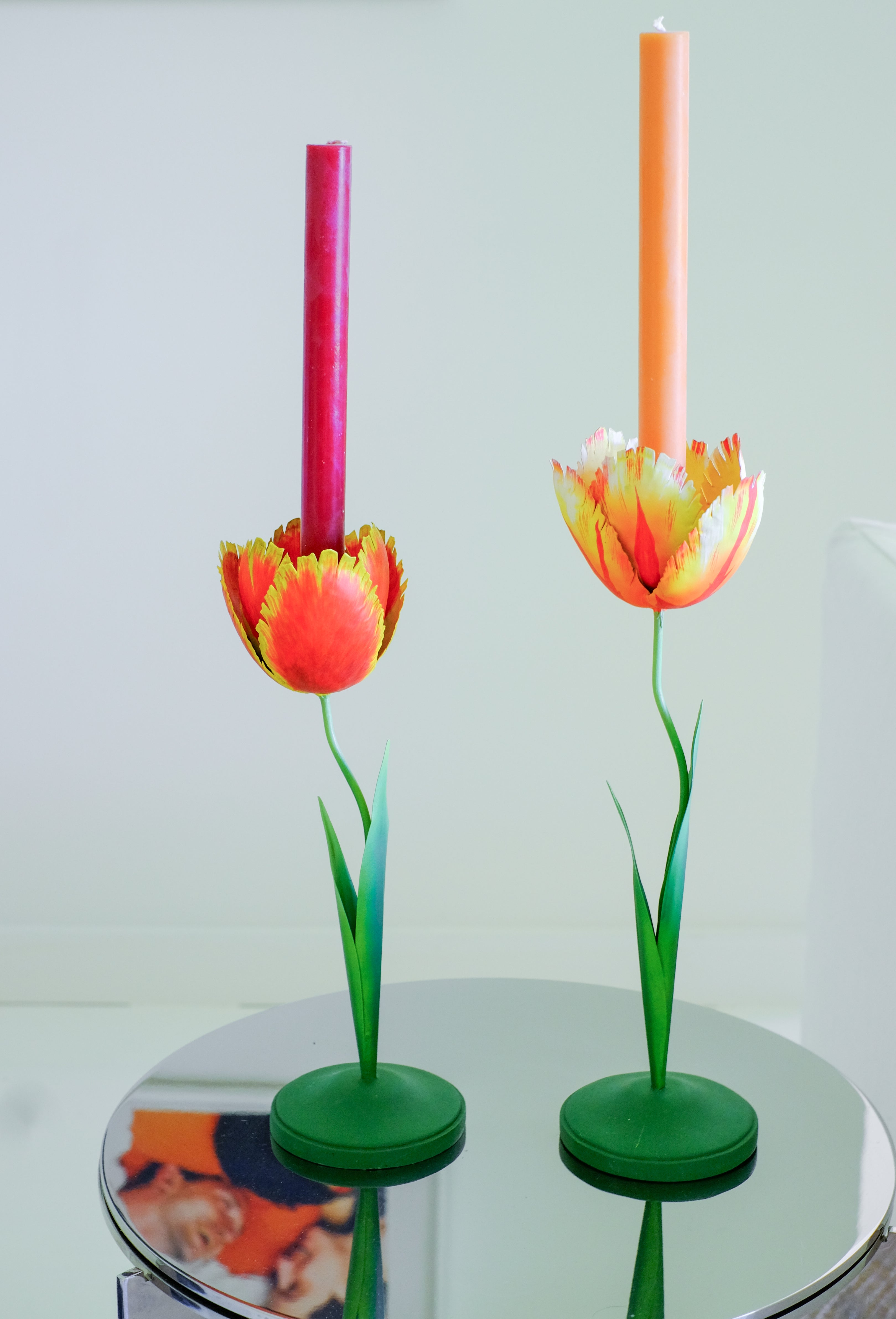 Medium tulip candleholders with red and orange candles, green bases