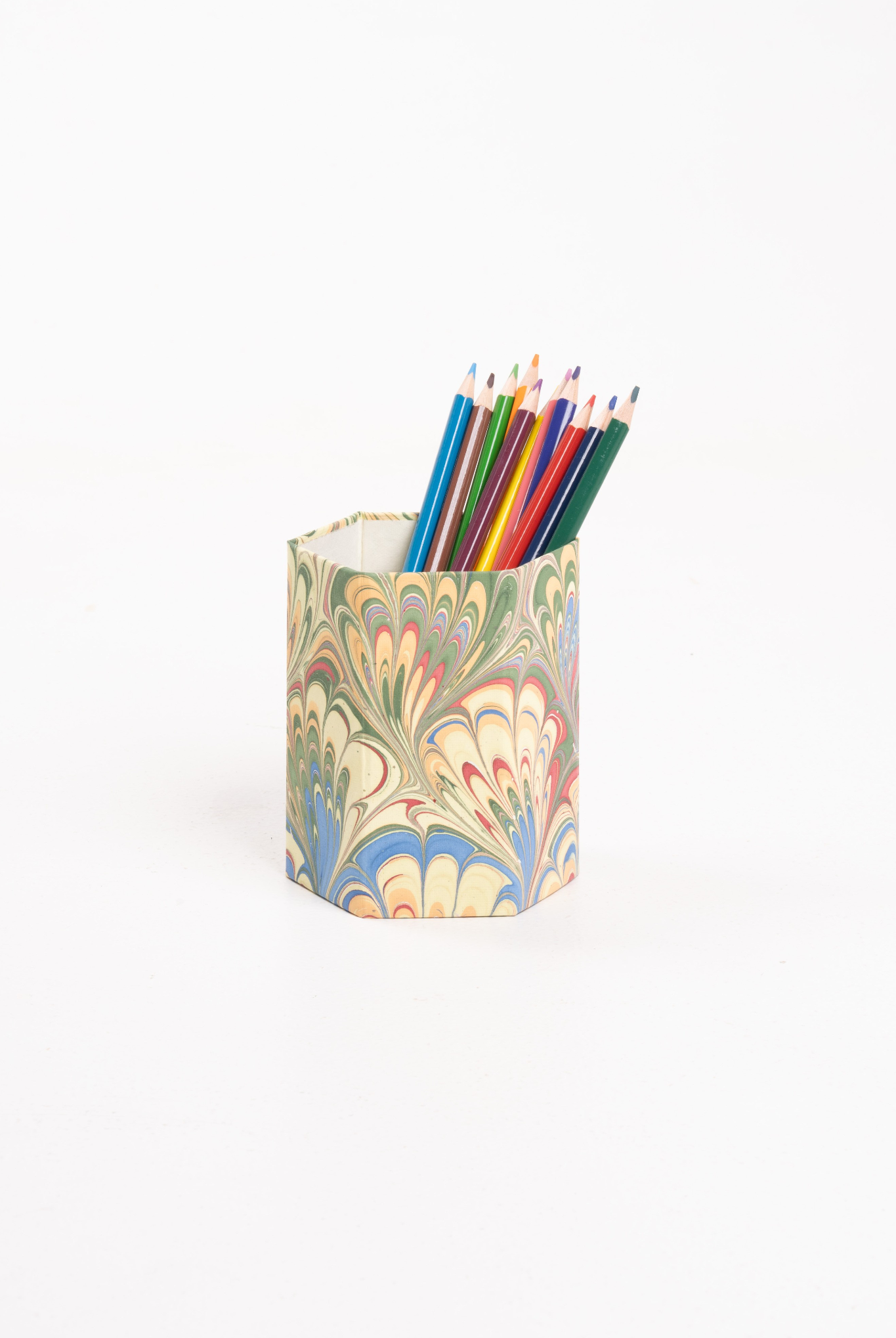 Hand-marbled pencil holder organizer in multicolor holding colored pencils