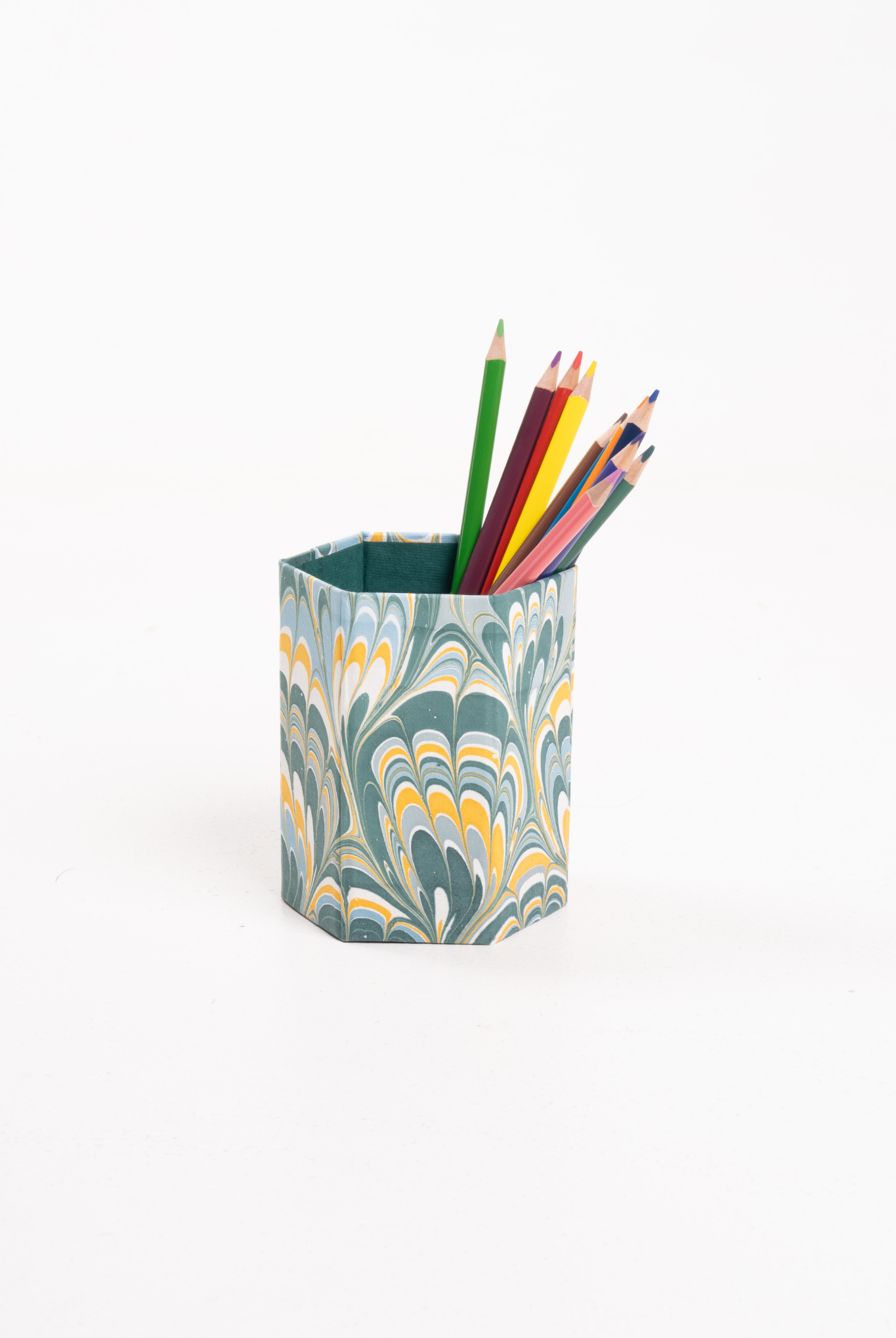 Hand-marbled pencil holder organizer filled with colored pencils from Inner Child