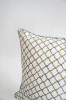 Blue poppy blockprint pillow showcasing geometric pattern with yellow accents