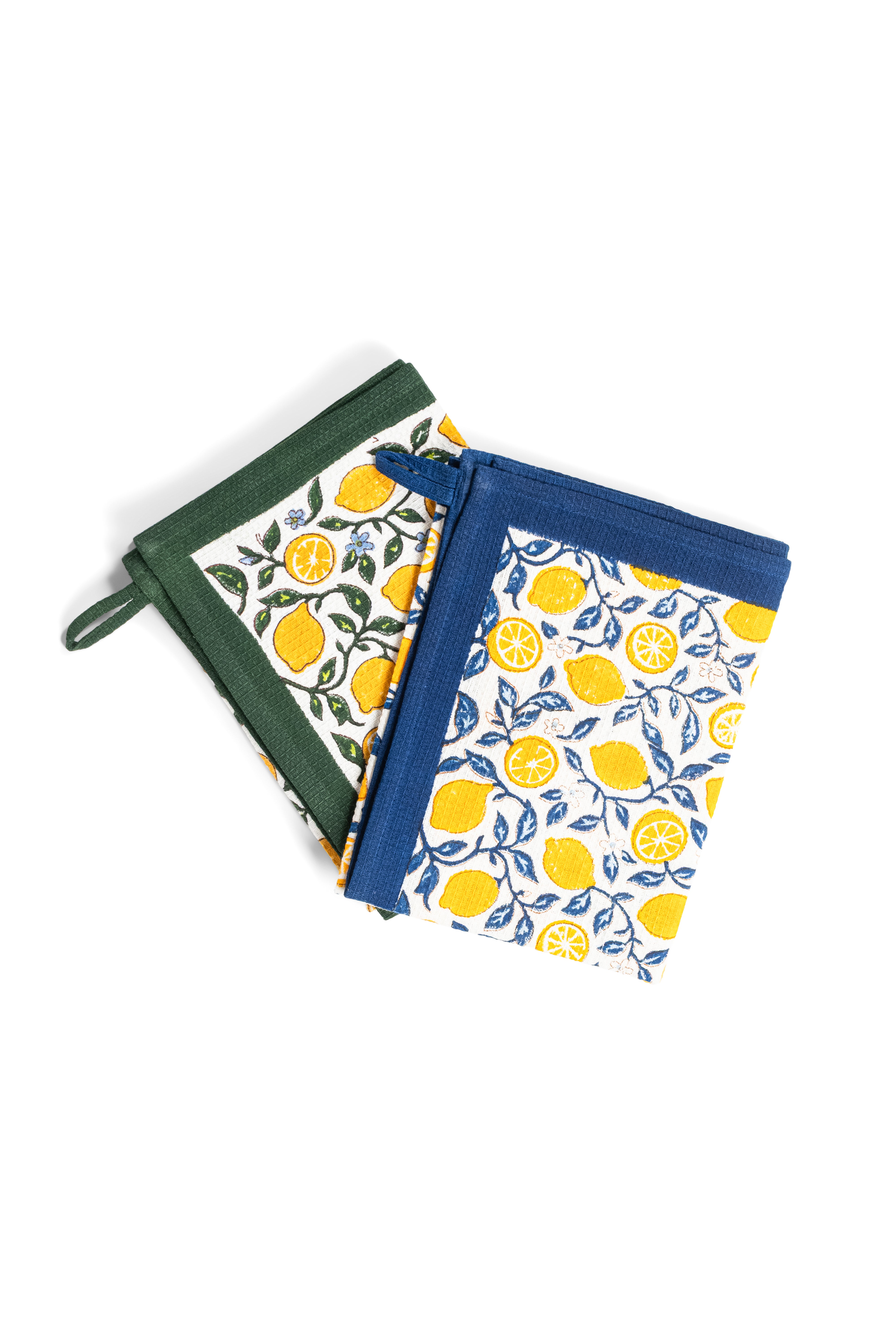 Two Capri Lemons Blockprint Kitchen Towels, one with green border and one with blue border, featuring yellow lemons, lemon slices, green leaves, and small blue flowers on white background