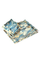 Inner Child trinket cocktail napkin tray with blue nila feathers marbling design