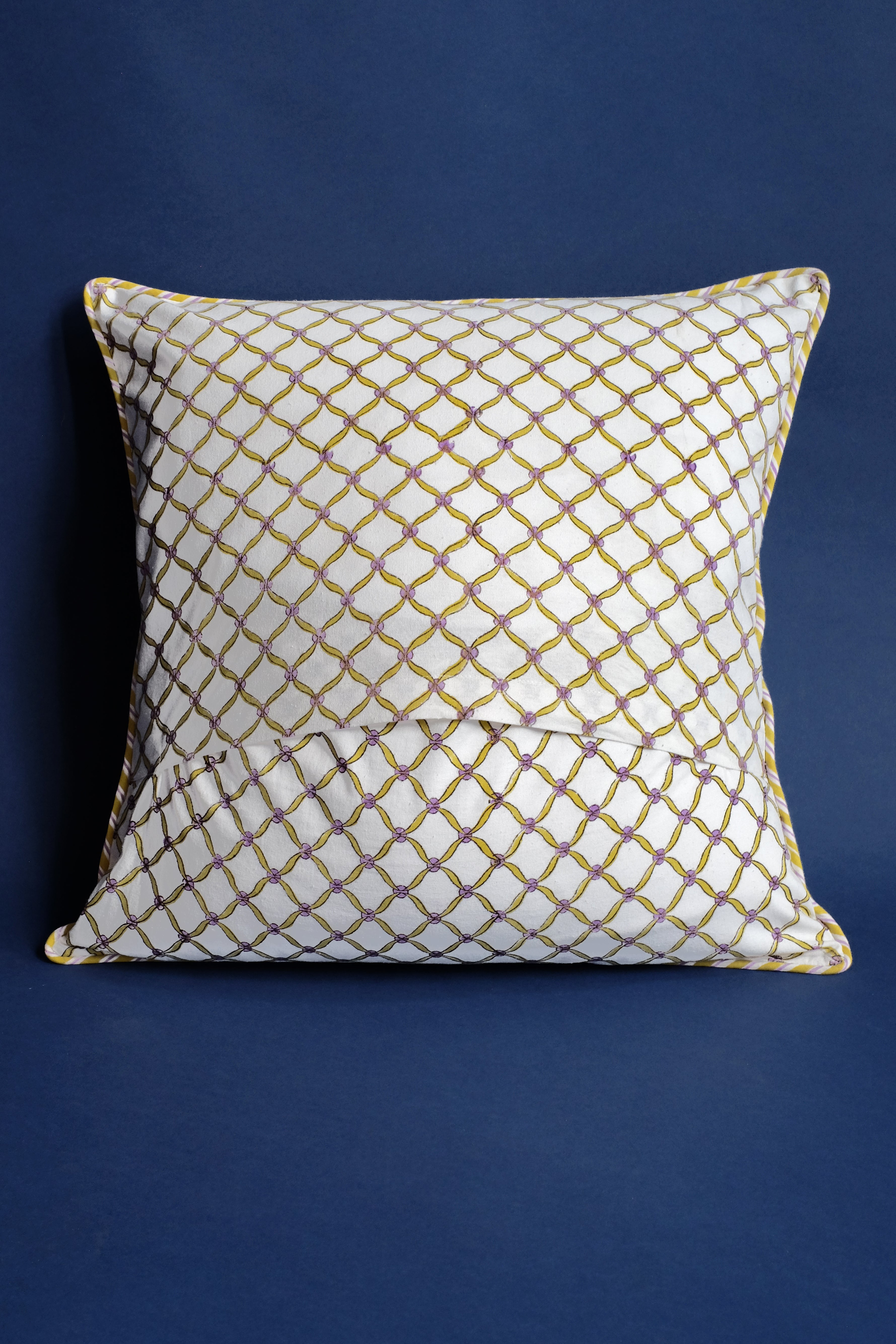 Yellow-purple geometric blockprint pillow on dark background - Inner Child