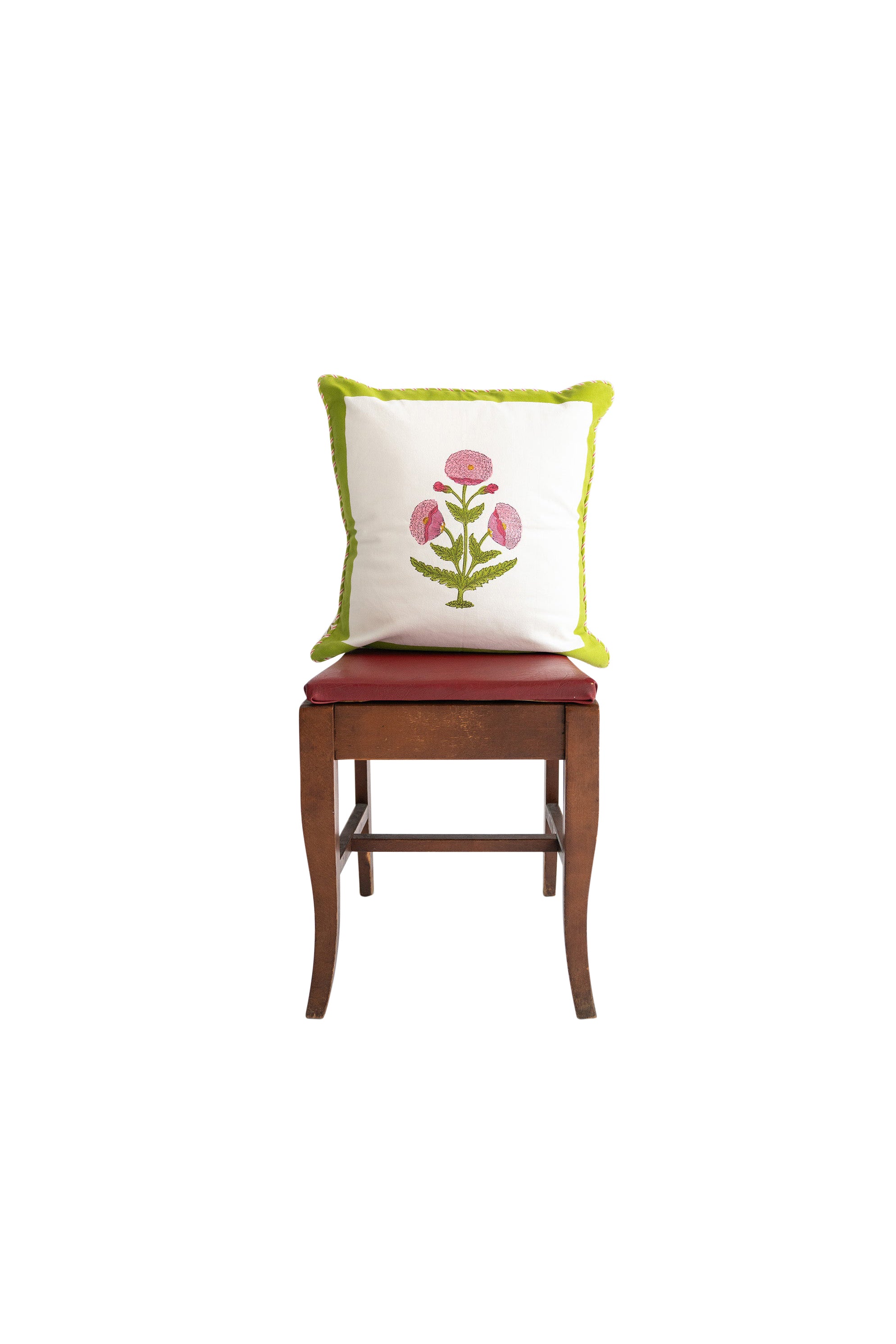 Pink poppy blockprint pillow on wooden chair