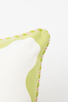 Pillow corner with green trim and striped edge detail