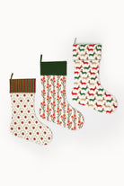 Blockprint stocking with red floral pattern, green foliage, dark green cuff - Inner Child holiday collection