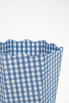 Close-up of blue gingham waste bin storage bin