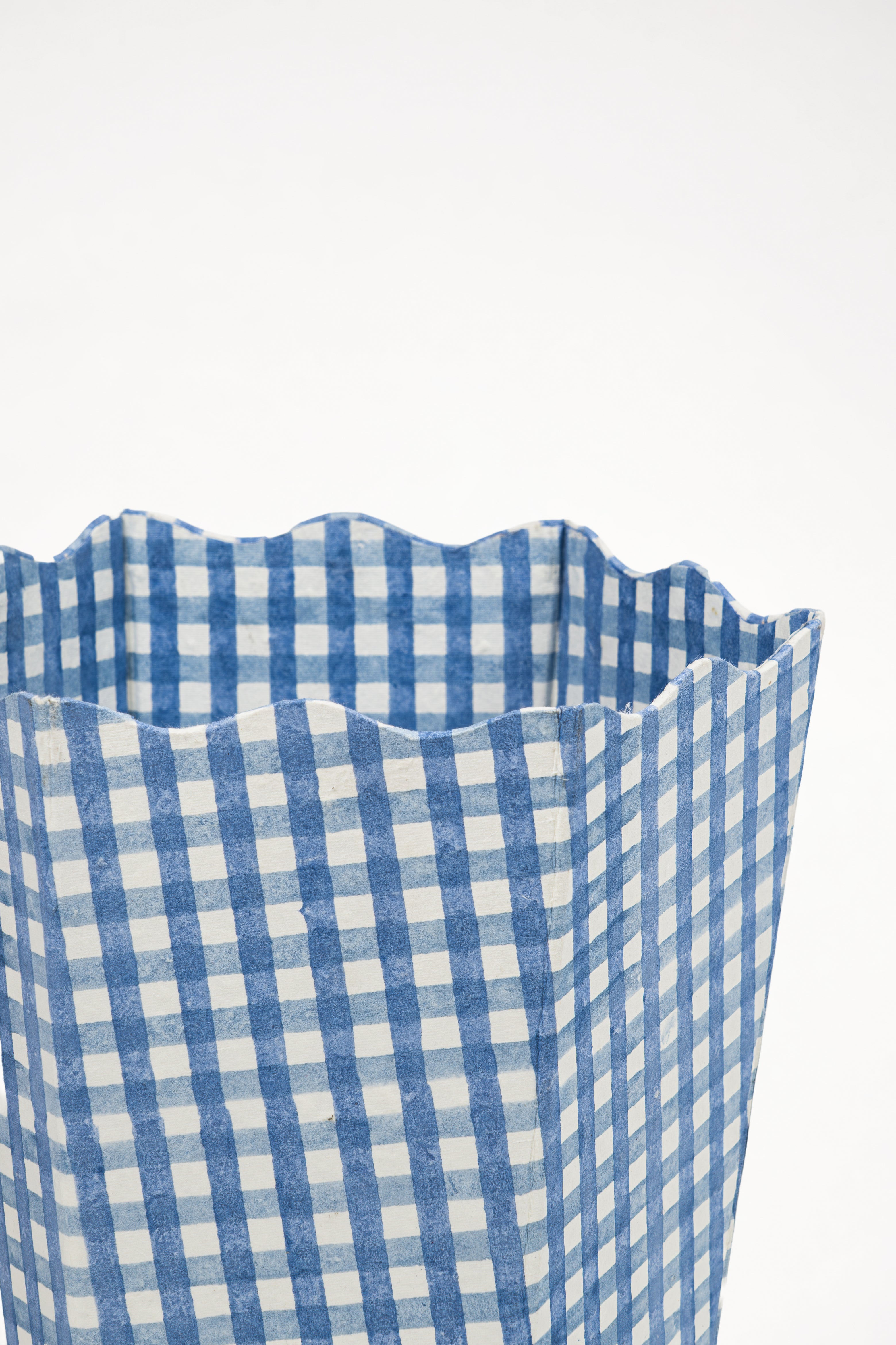Close-up of blue gingham waste bin storage bin