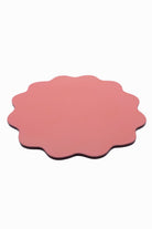 Blush pink scalloped edge placemat with smooth surface