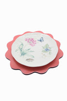 Inner Child blush pink scalloped lacquerware placemat set with floral butterfly designs
