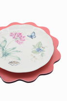 Inner Child blush pink scalloped lacquerware placemat set with detailed botanical illustrations