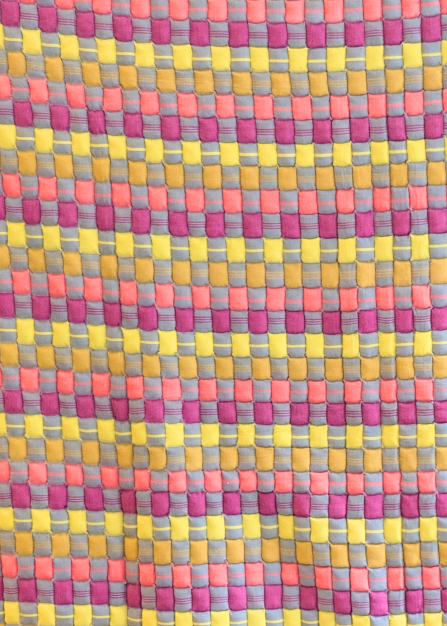 Close-up of colorful cotton candy sujani quilt pattern