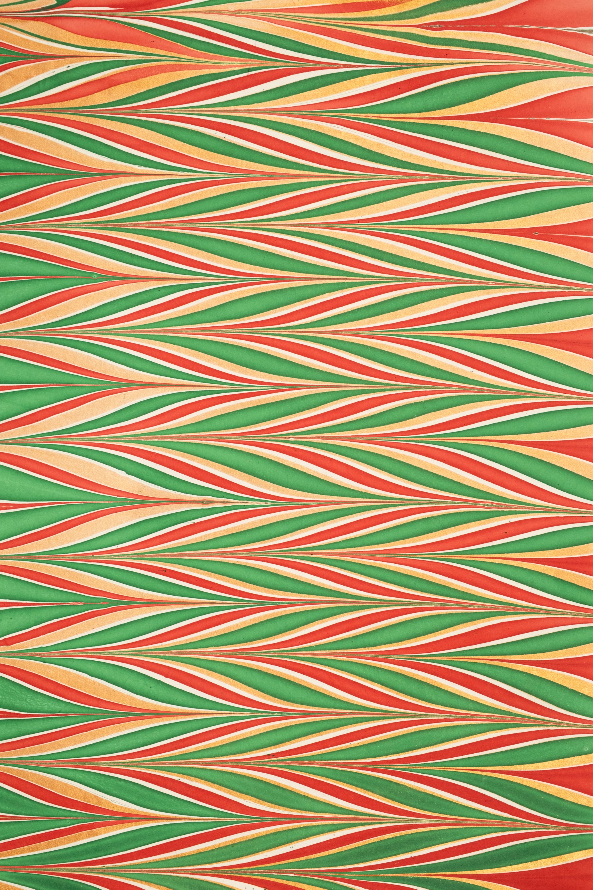 Hand marbled gilded holiday gift wrapping paper single sheet with red green gold wavy stripe pattern