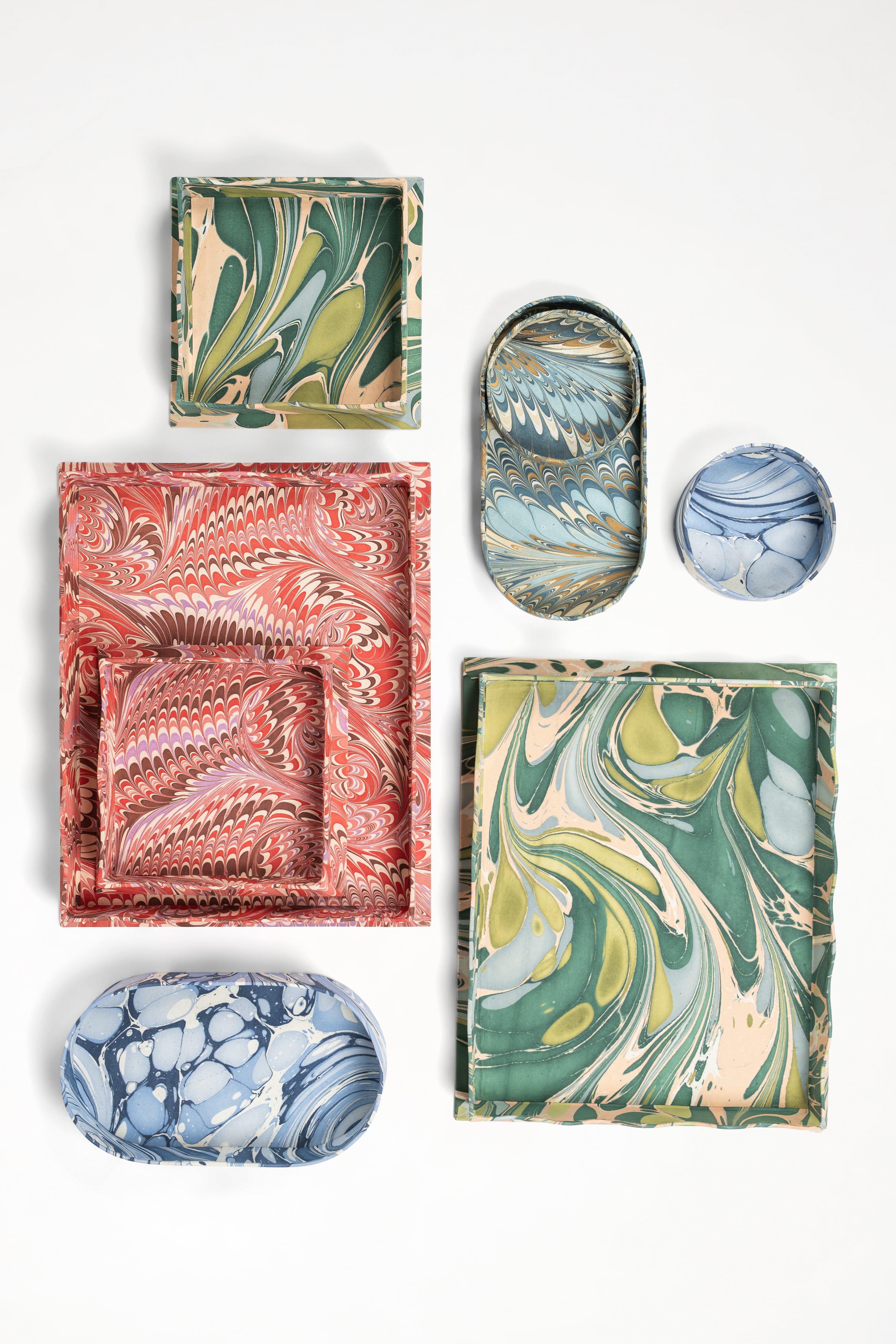 Collection of nesting scalloped hand-marbled trays