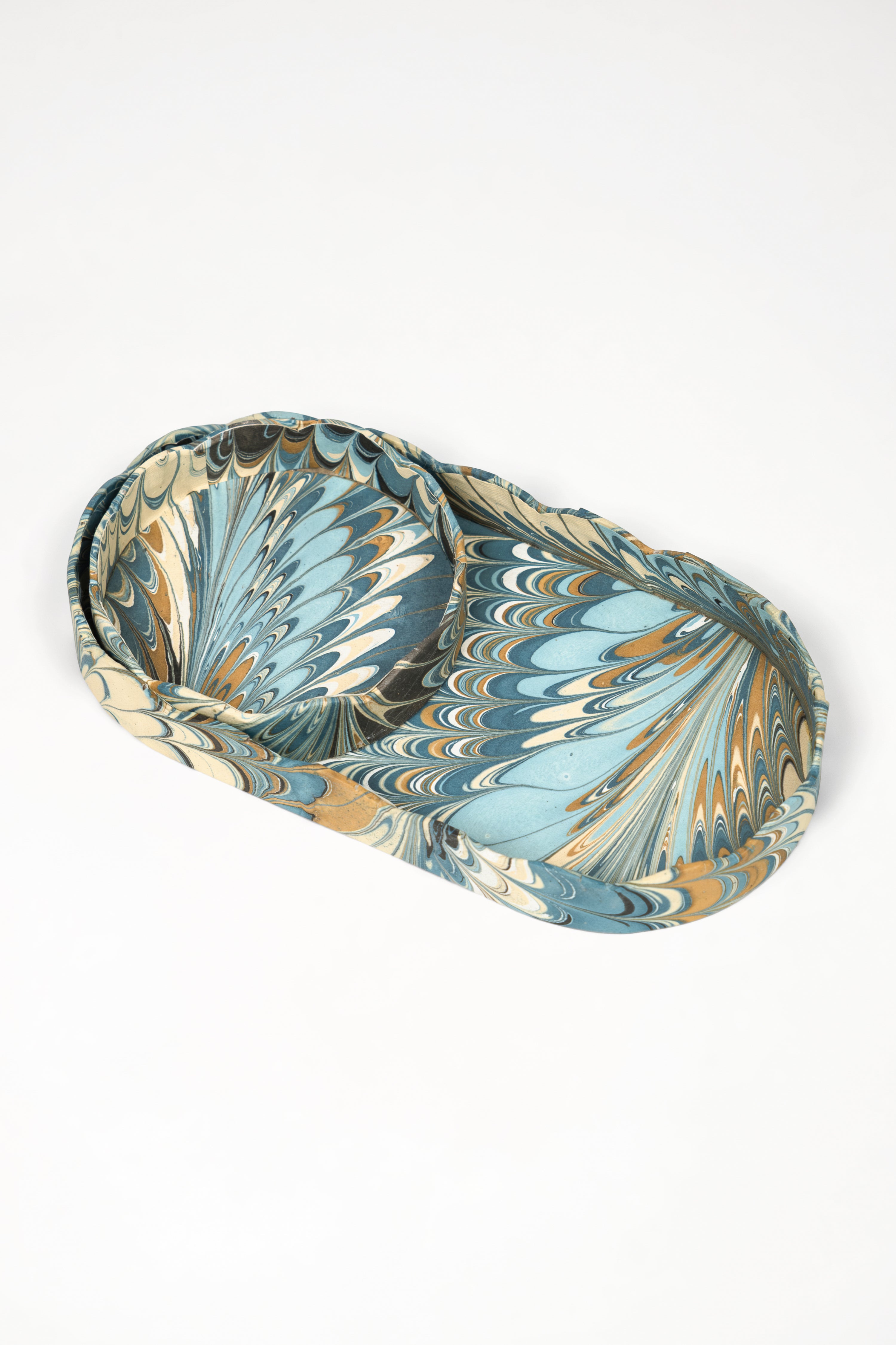 Inner Child nesting scalloped hand-marbled oval desk trays in nila feathers