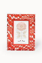Front-facing hand-marbled 4x6 frame in red-white candy cane swirl from Inner Child