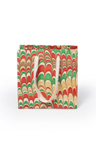 Small hand-marbled holiday gift bag with red-green patterns from Inner Child