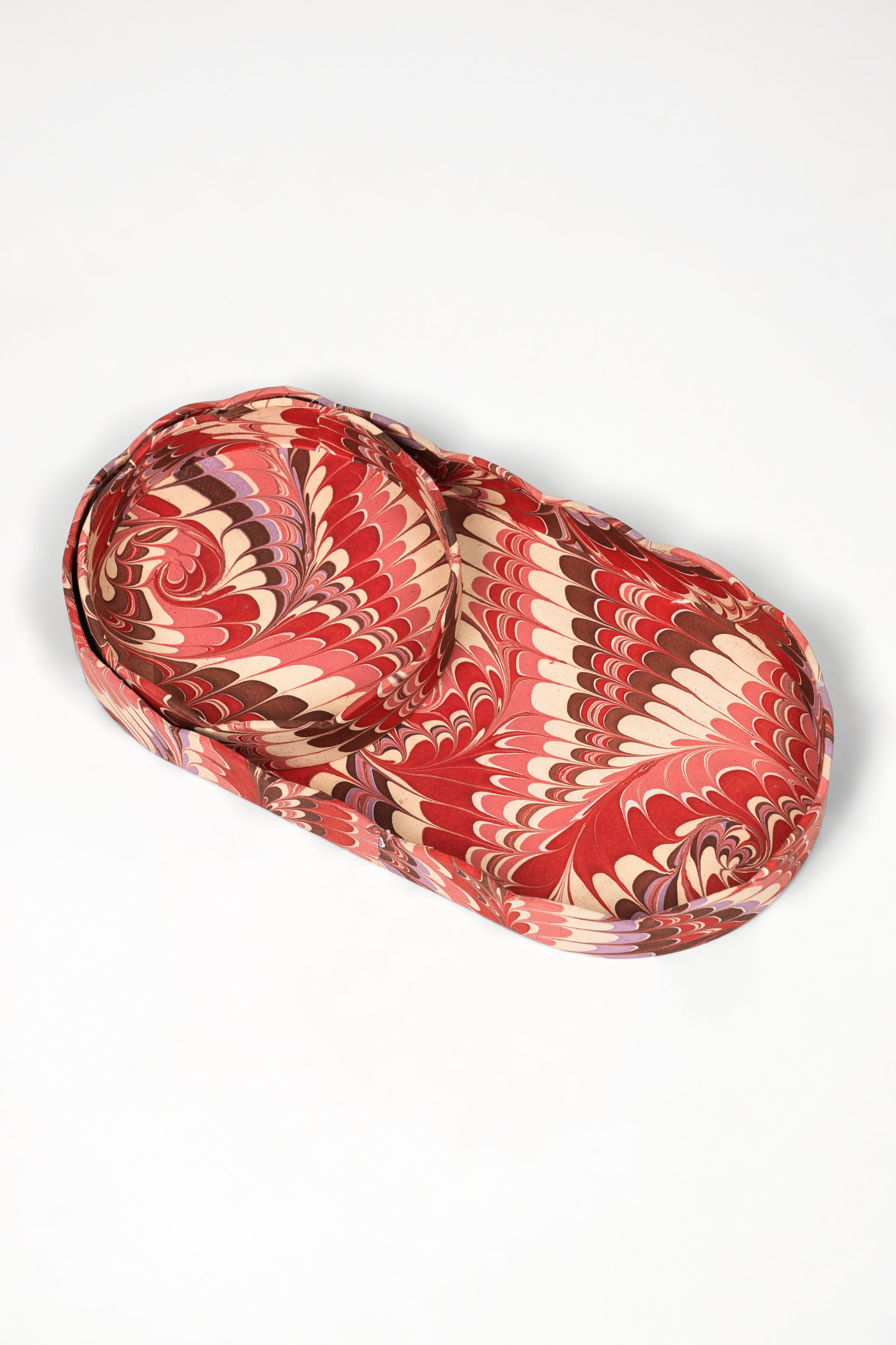 Inner Child nesting scalloped hand-marbled oval desk trays in florentine pink